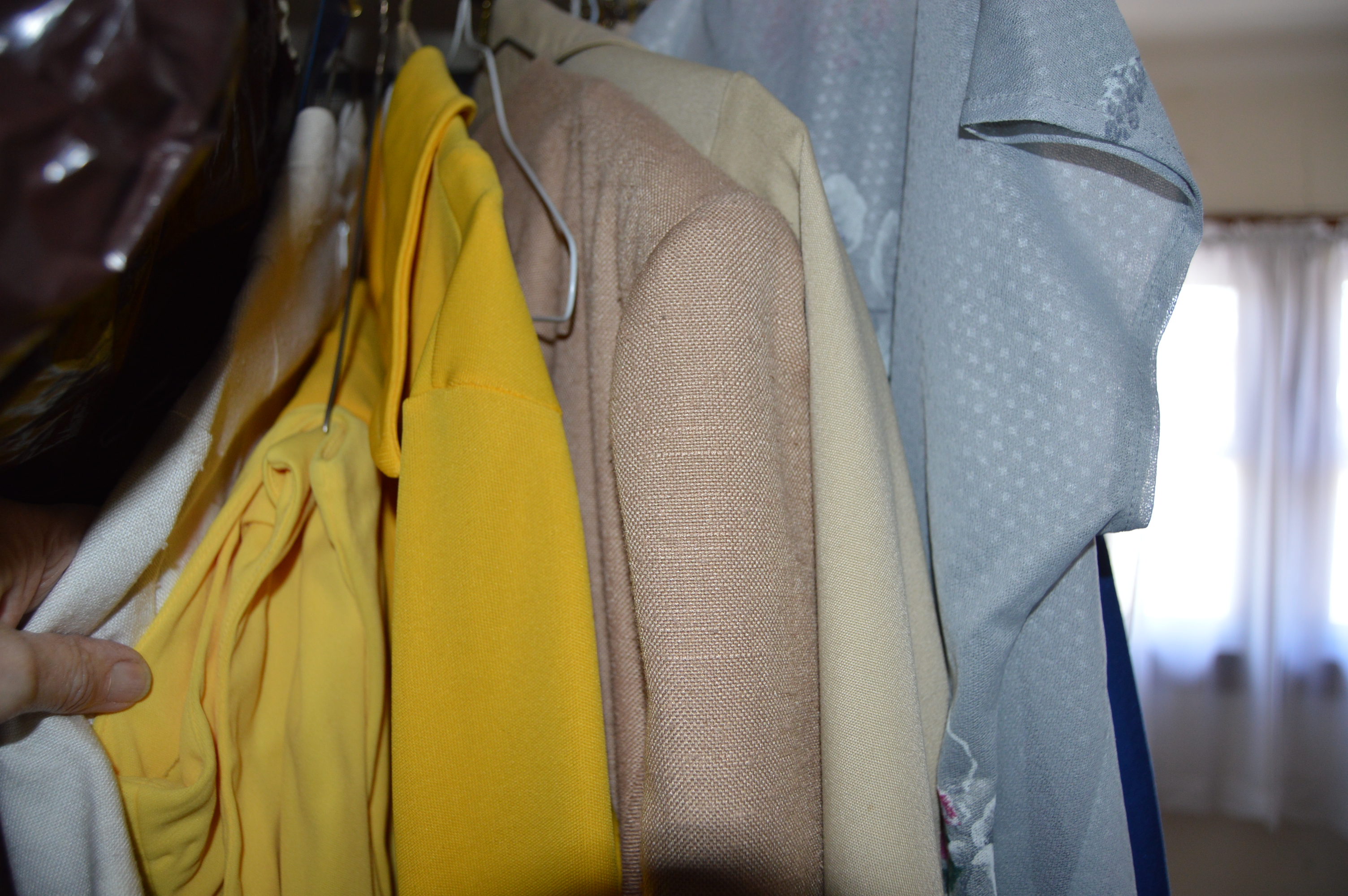 Vintage Iron Revolving Clothing Rack with Vintage Clothes Collection