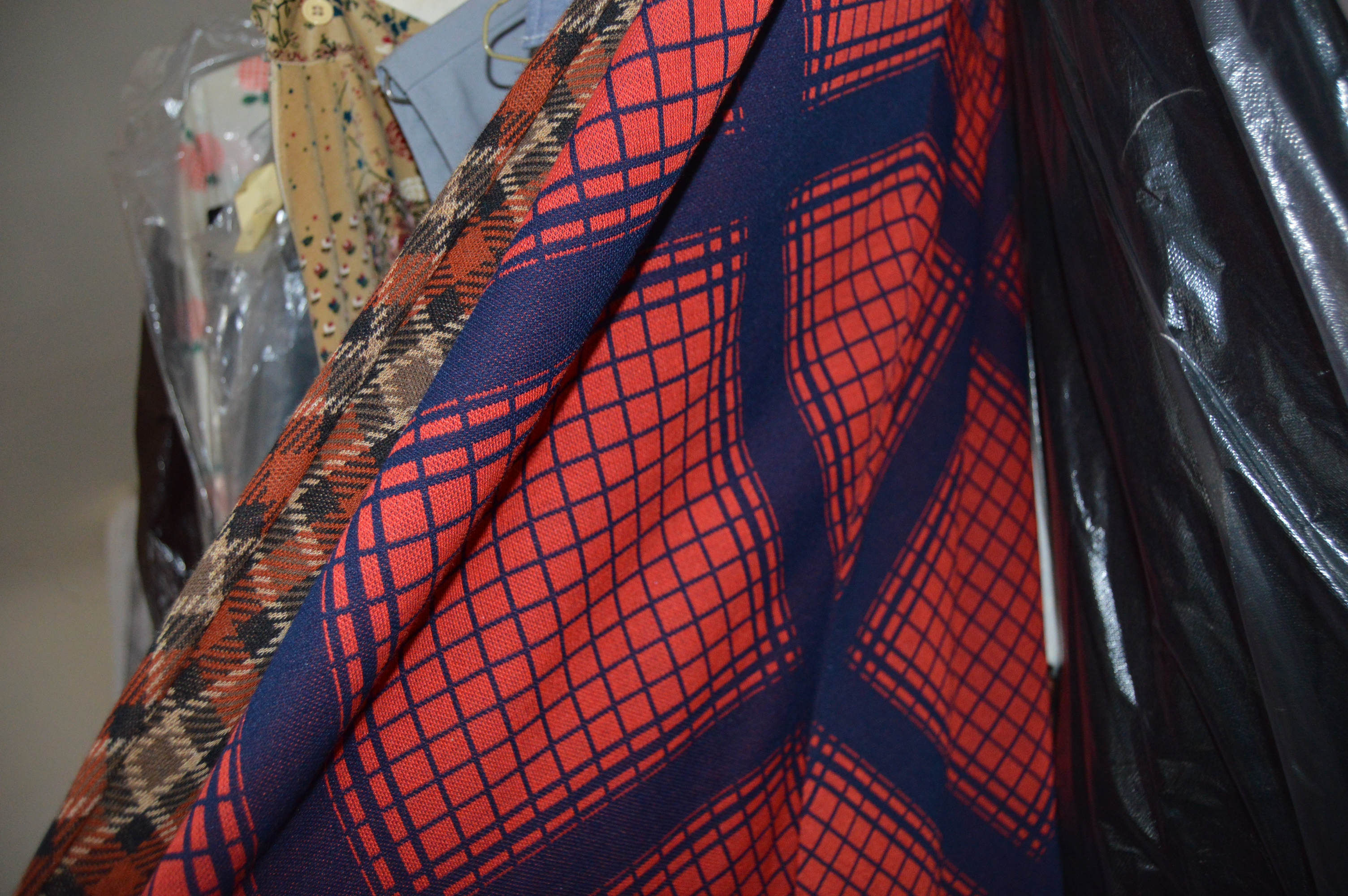 Vintage Iron Revolving Clothing Rack with Vintage Clothes Collection