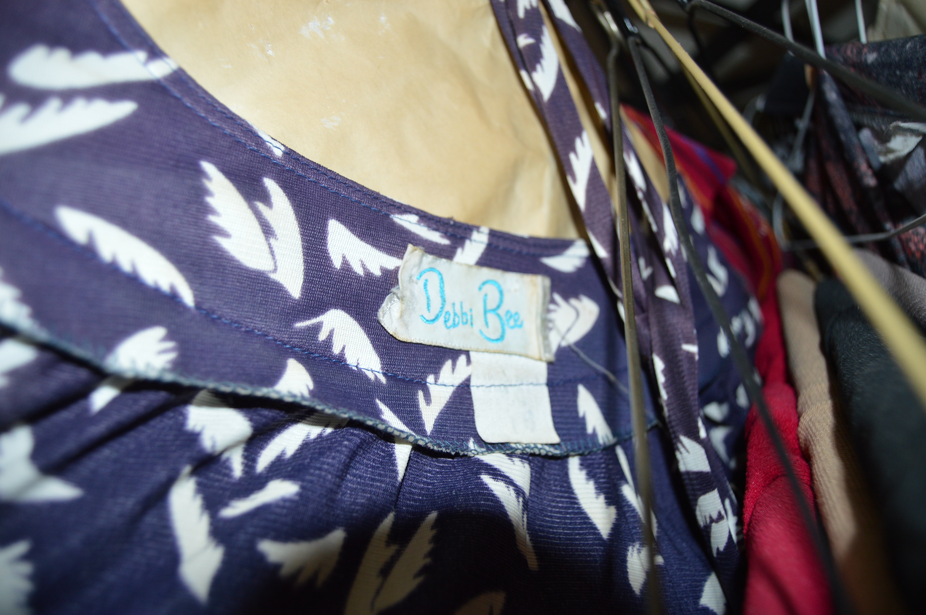 Vintage Iron Revolving Clothing Rack with Vintage Clothes Collection