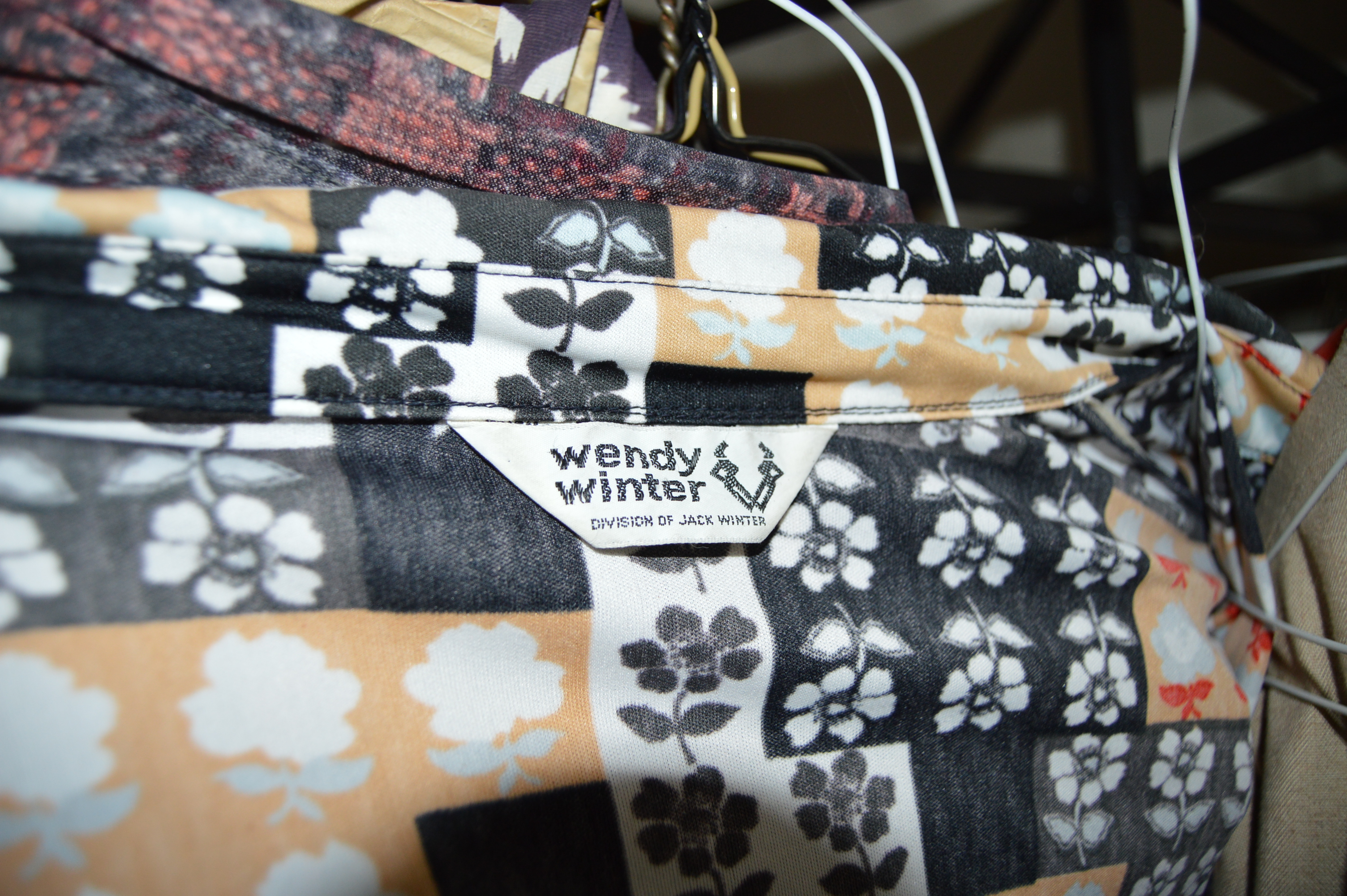 Vintage Iron Revolving Clothing Rack with Vintage Clothes Collection