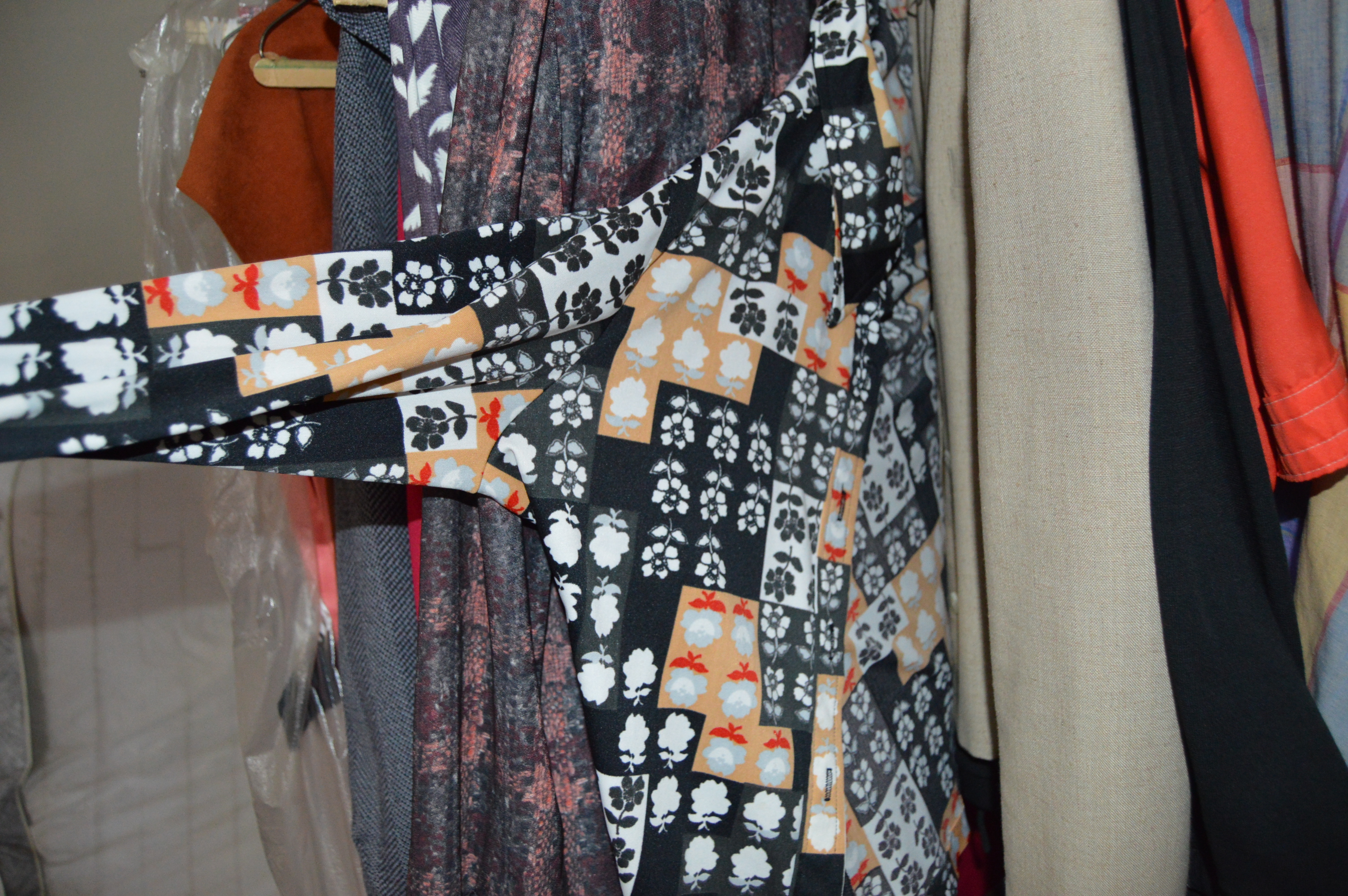 Vintage Iron Revolving Clothing Rack with Vintage Clothes Collection