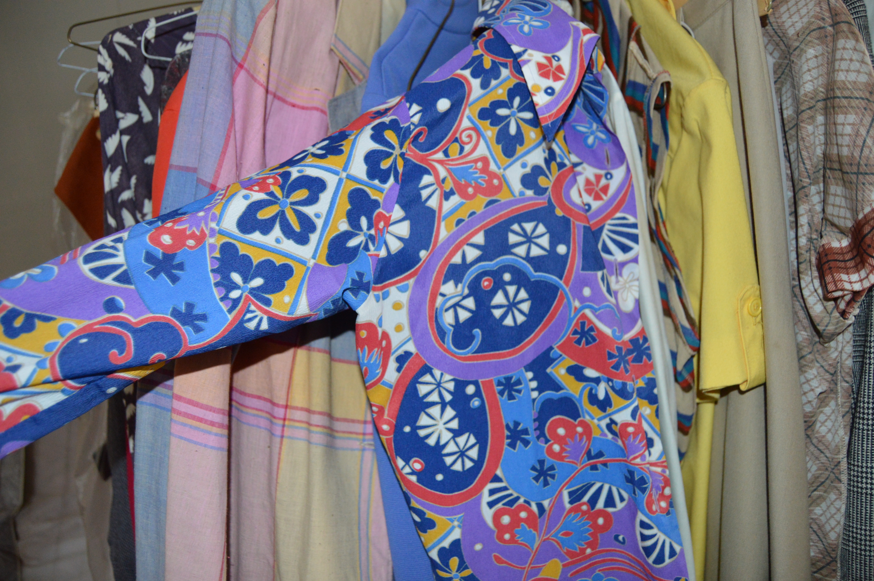 Vintage Iron Revolving Clothing Rack with Vintage Clothes Collection