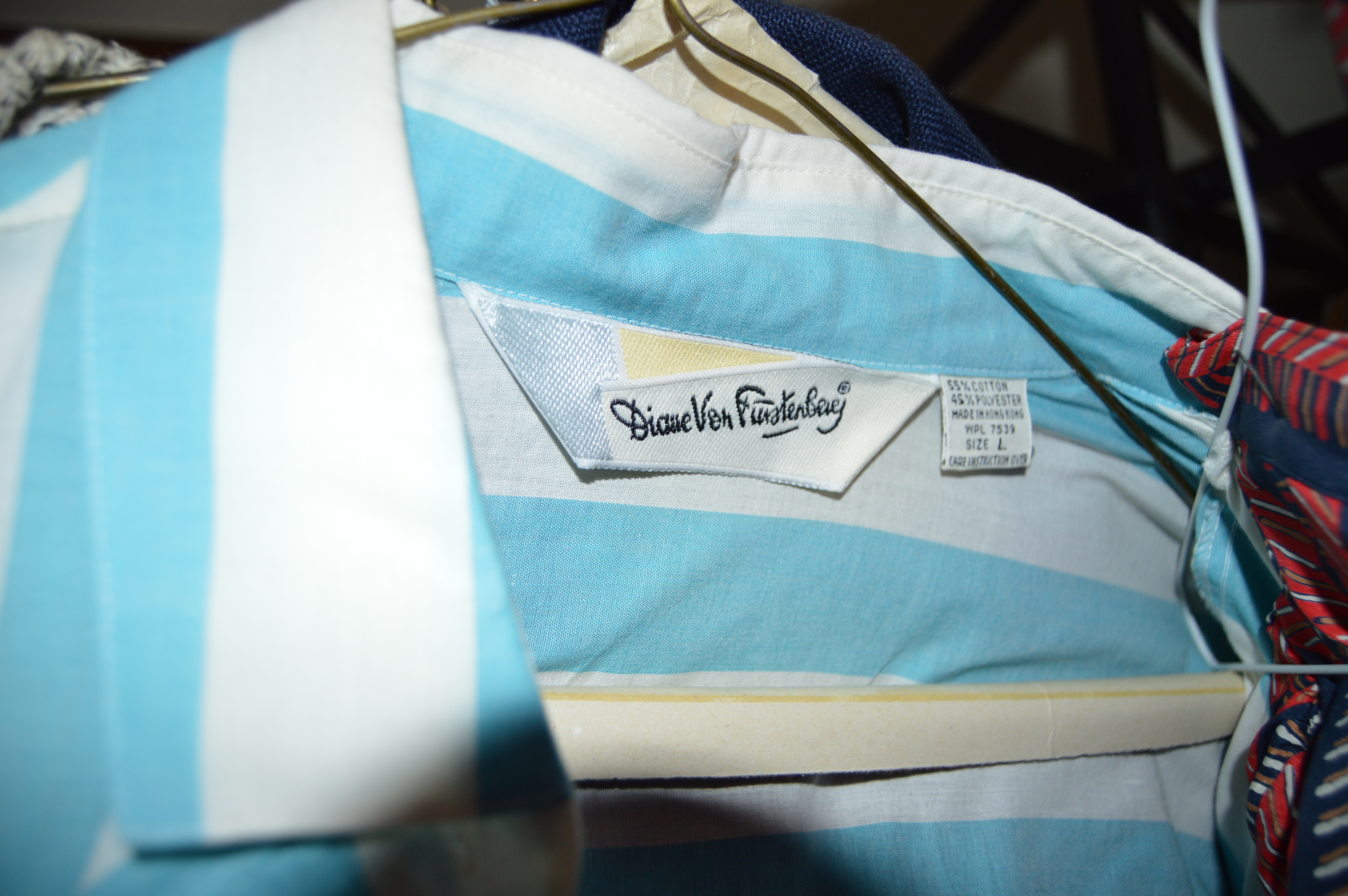 Vintage Iron Revolving Clothing Rack with Vintage Clothes Collection