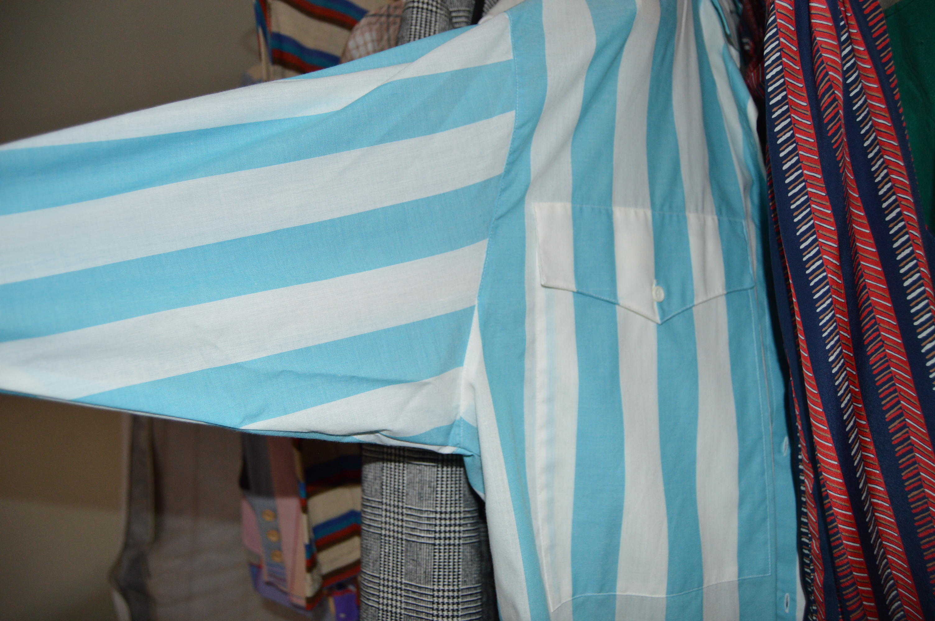 Vintage Iron Revolving Clothing Rack with Vintage Clothes Collection