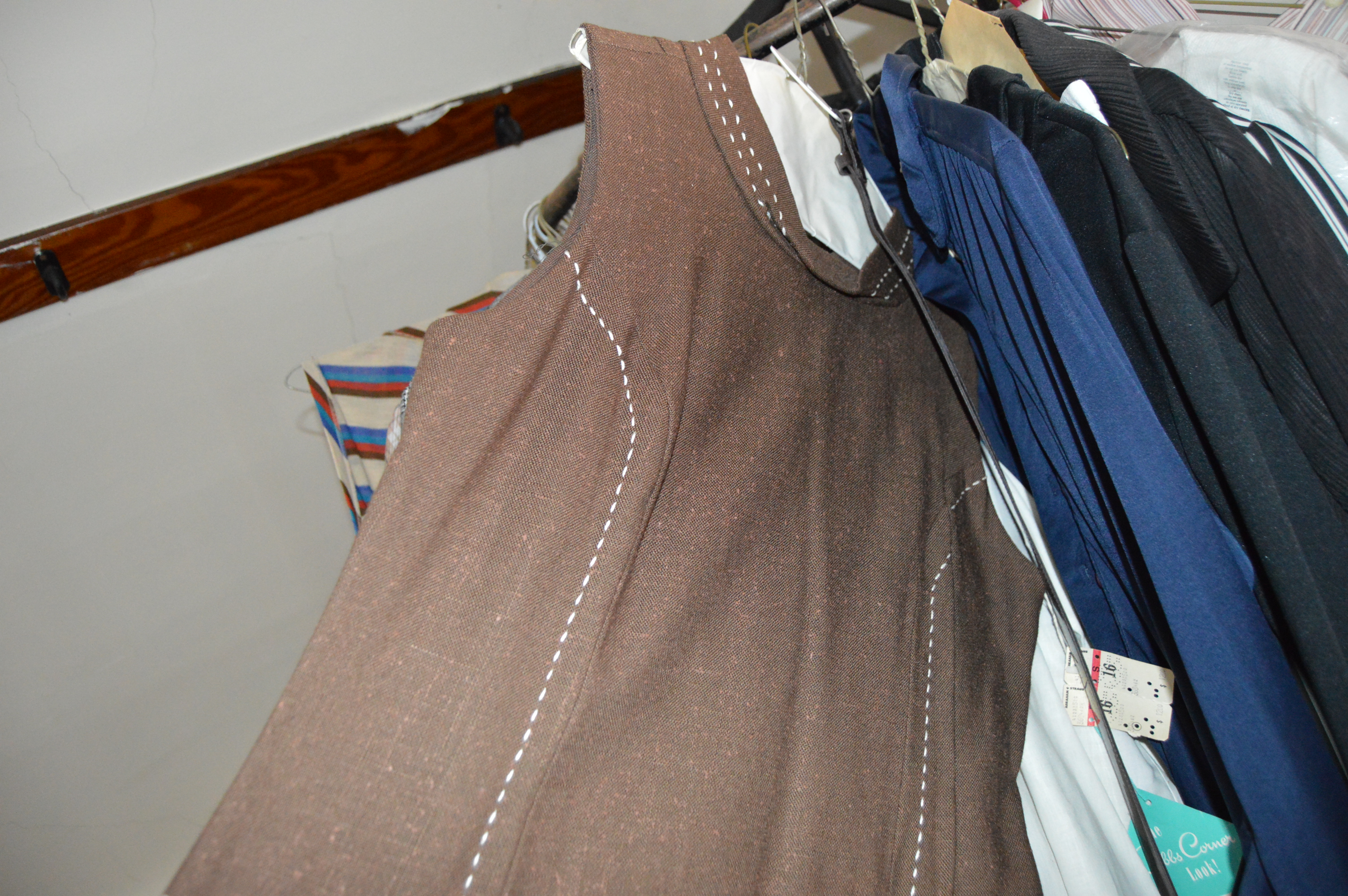 Vintage Iron Revolving Clothing Rack with Vintage Clothes Collection