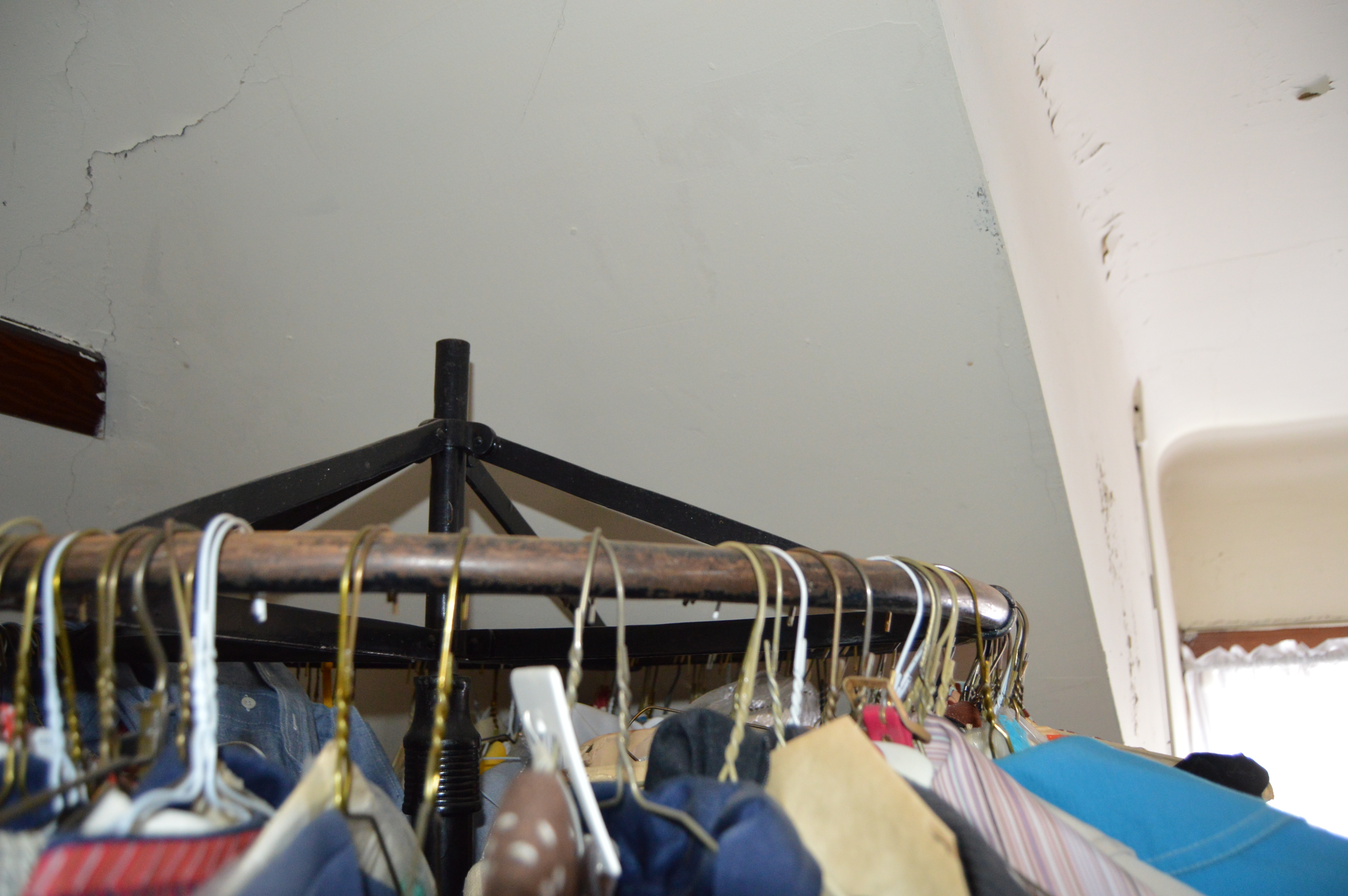 Vintage Iron Revolving Clothing Rack with Vintage Clothes Collection