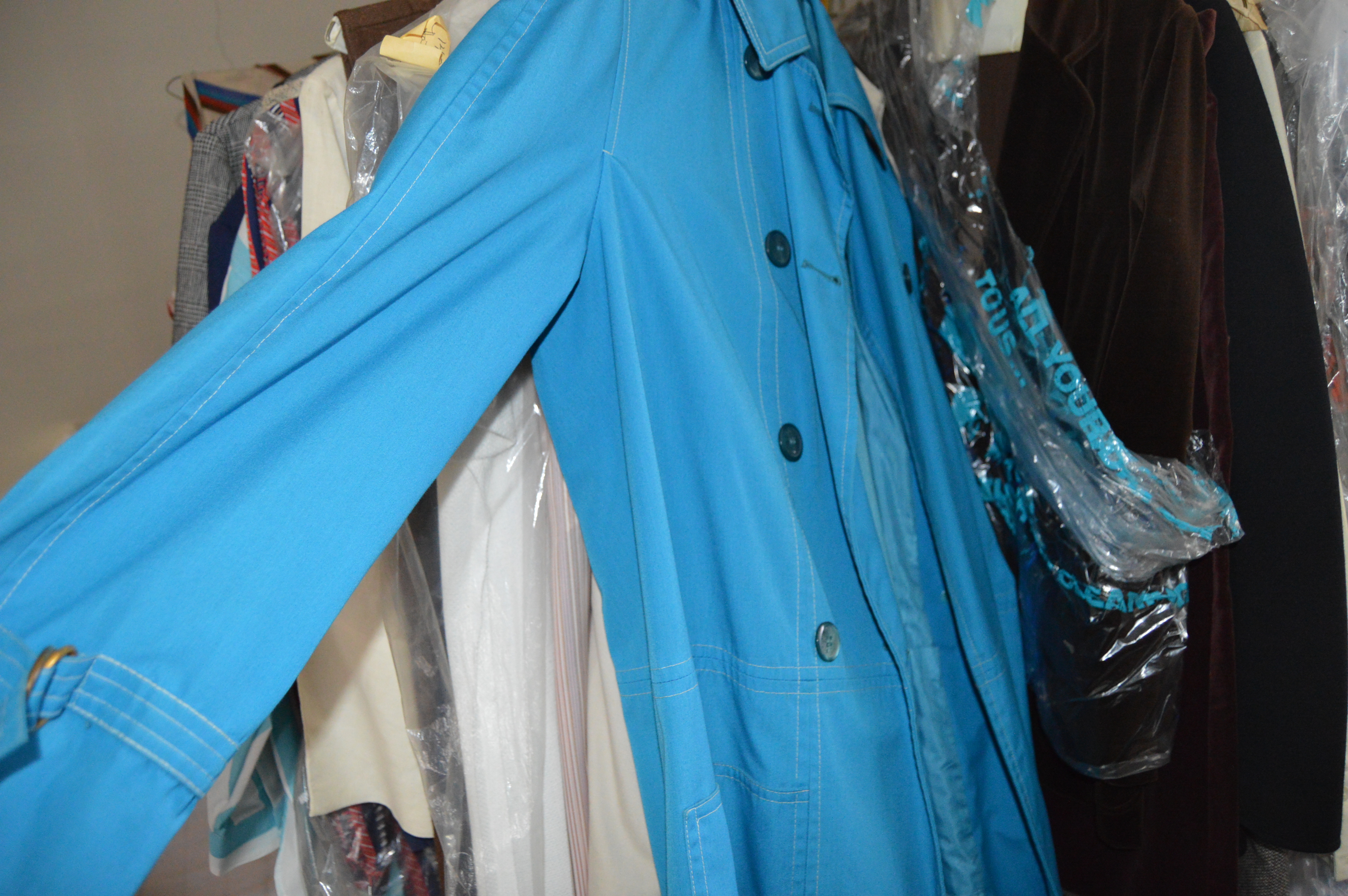 Vintage Iron Revolving Clothing Rack with Vintage Clothes Collection