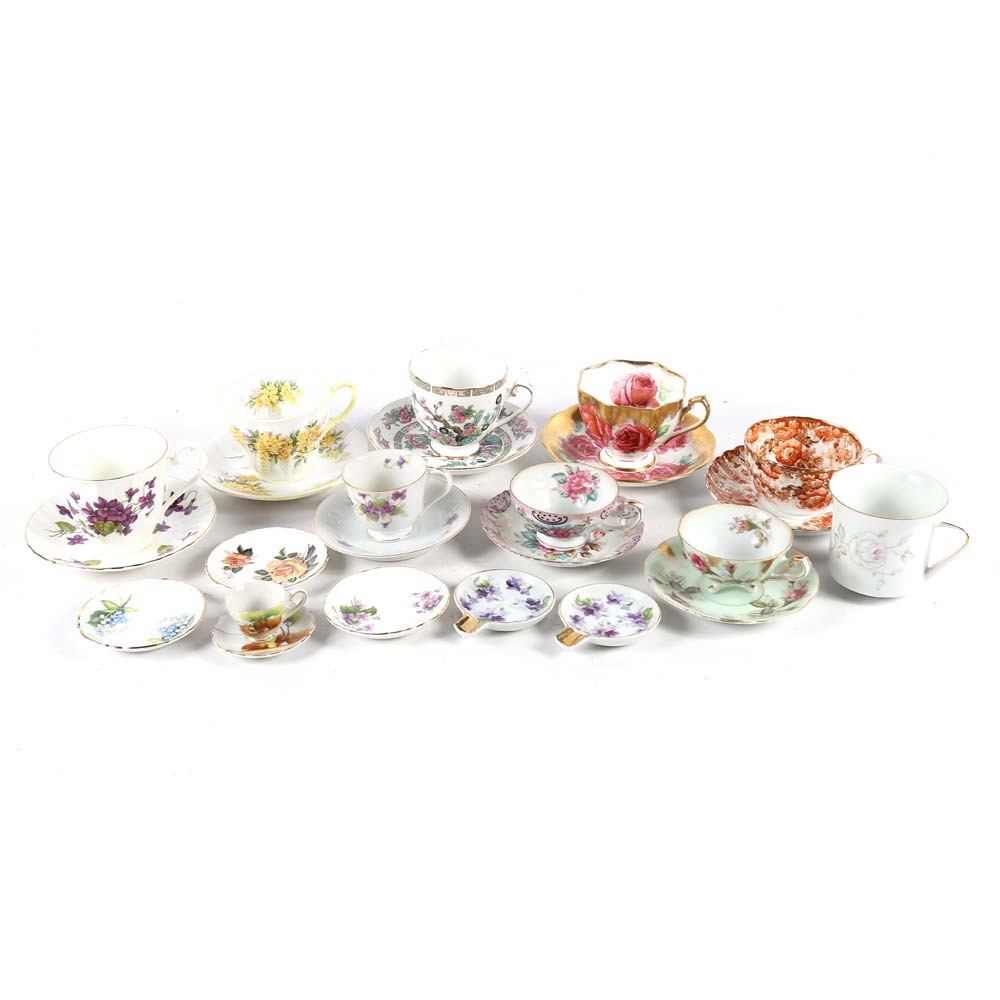 Assortment of Tea Cups, Saucers, and Spoon Rest