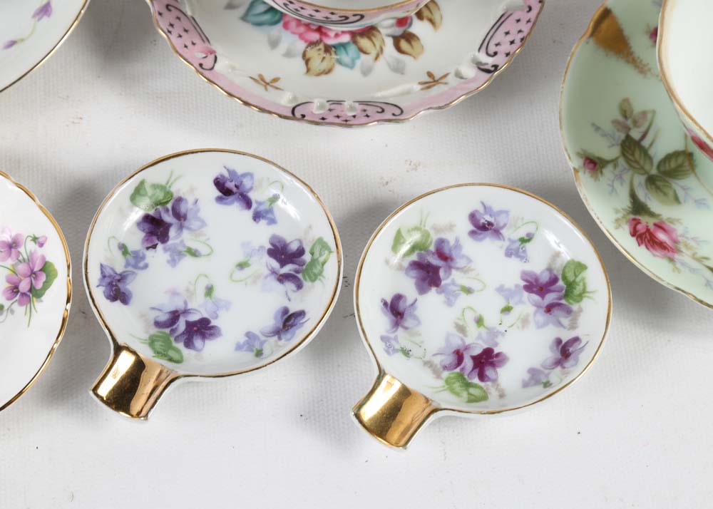 Assortment of Tea Cups, Saucers, and Spoon Rest