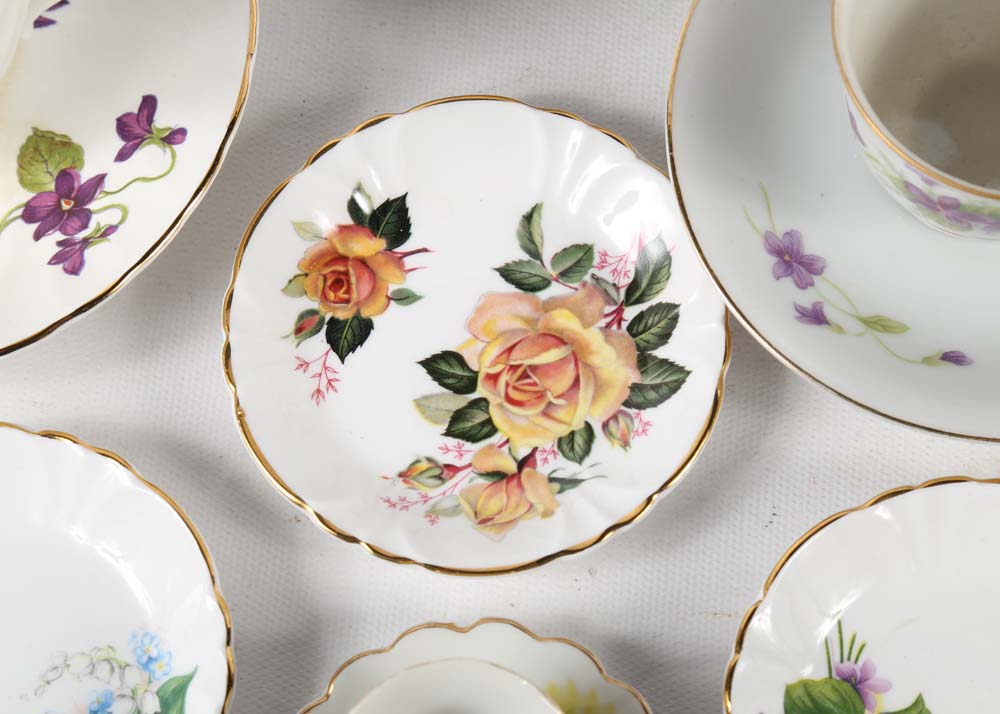 Assortment of Tea Cups, Saucers, and Spoon Rest