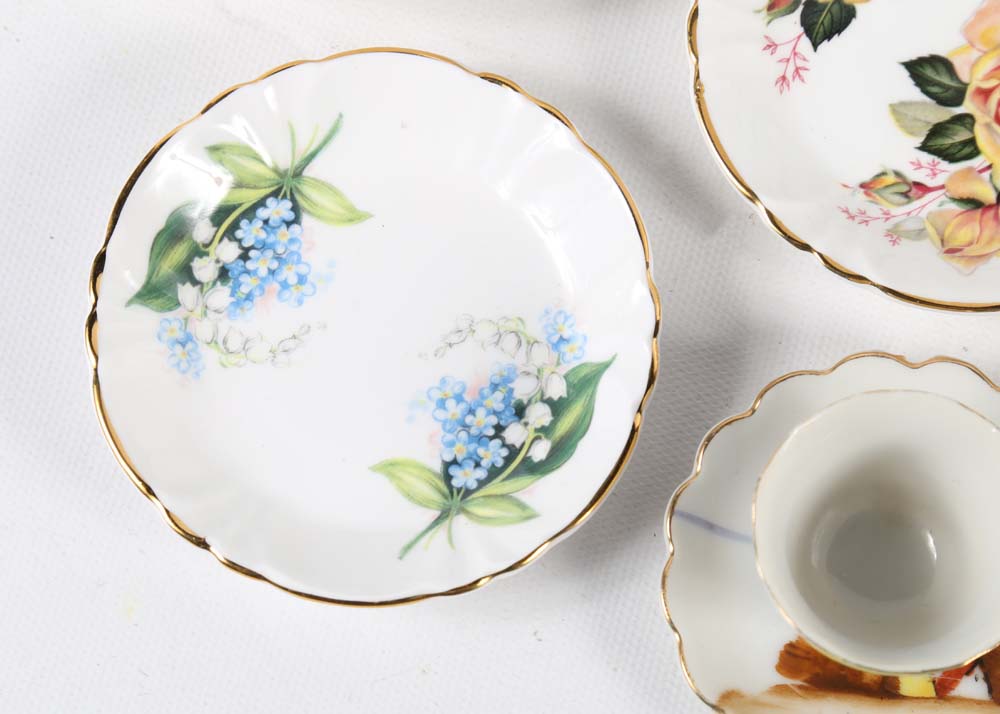 Assortment of Tea Cups, Saucers, and Spoon Rest