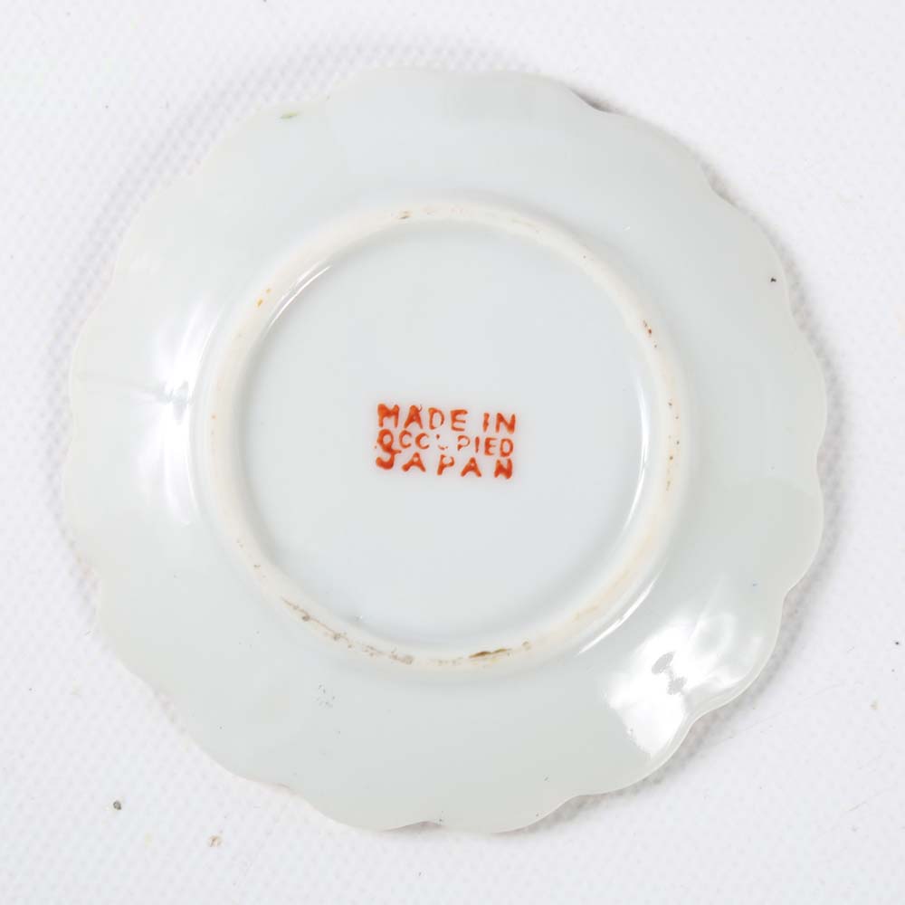 Assortment of Tea Cups, Saucers, and Spoon Rest