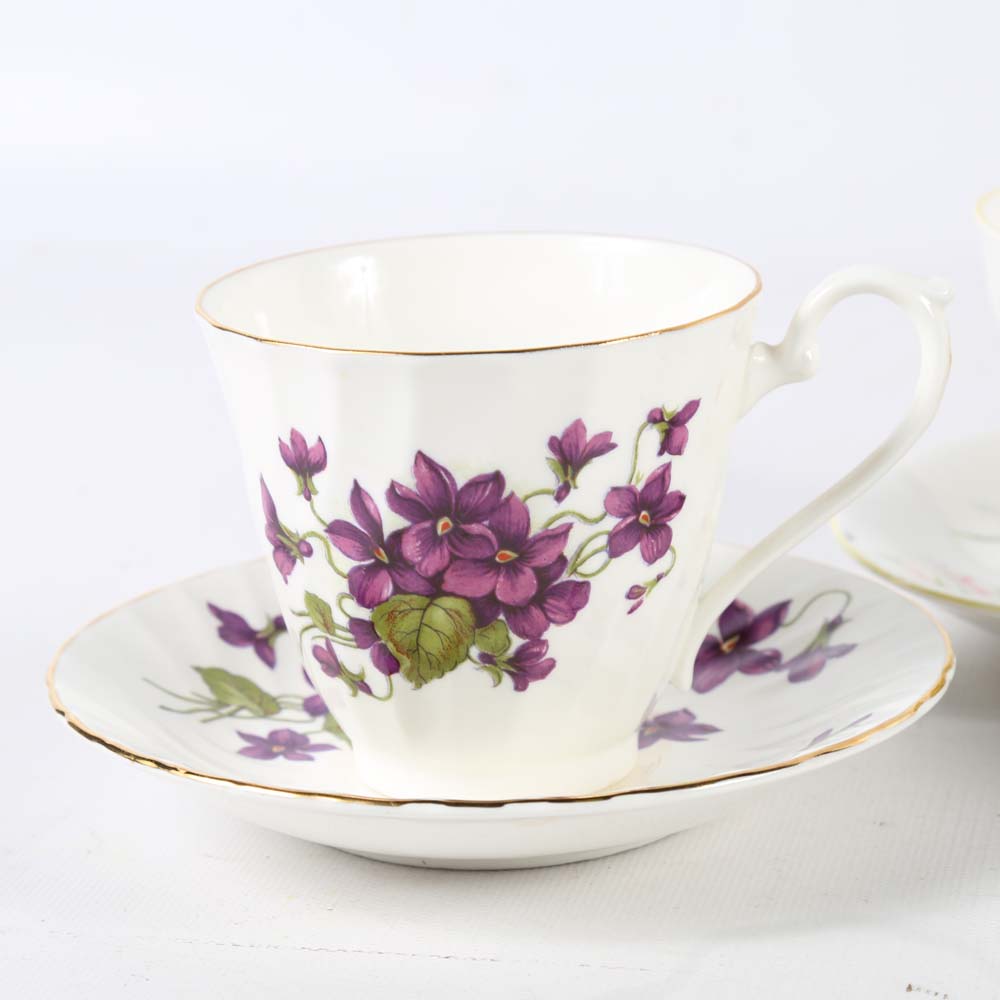 Assortment of Tea Cups, Saucers, and Spoon Rest