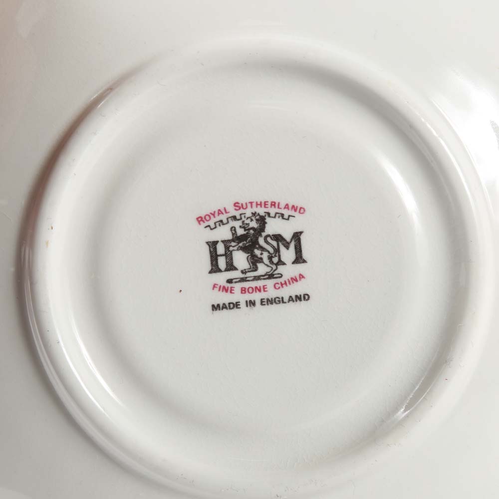 Assortment of Tea Cups, Saucers, and Spoon Rest