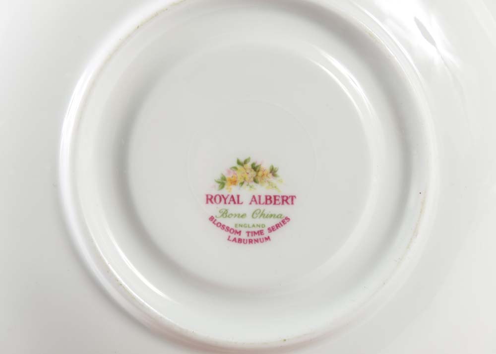 Assortment of Tea Cups, Saucers, and Spoon Rest