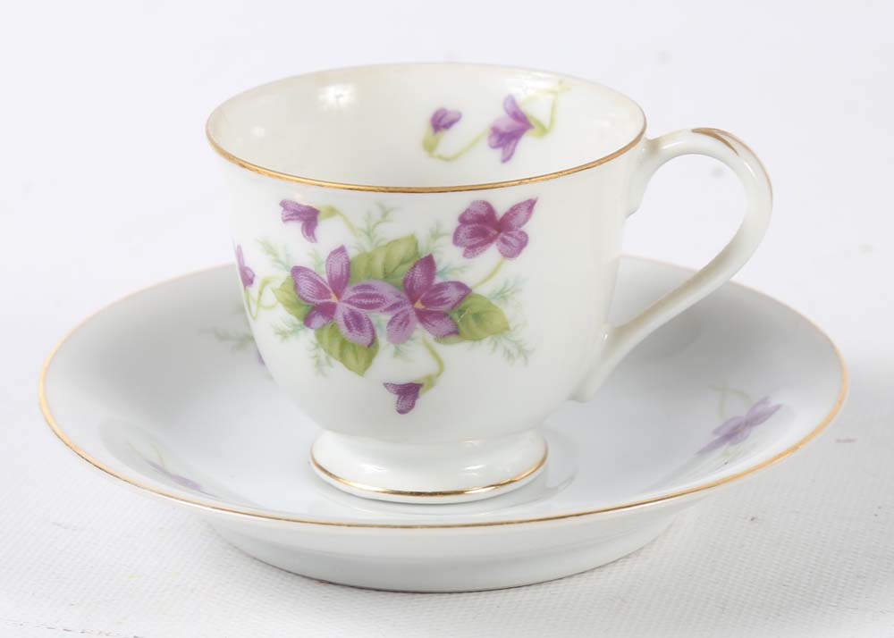 Assortment of Tea Cups, Saucers, and Spoon Rest