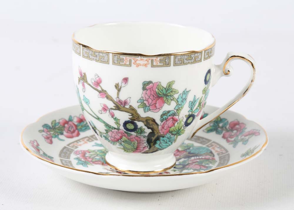 Assortment of Tea Cups, Saucers, and Spoon Rest