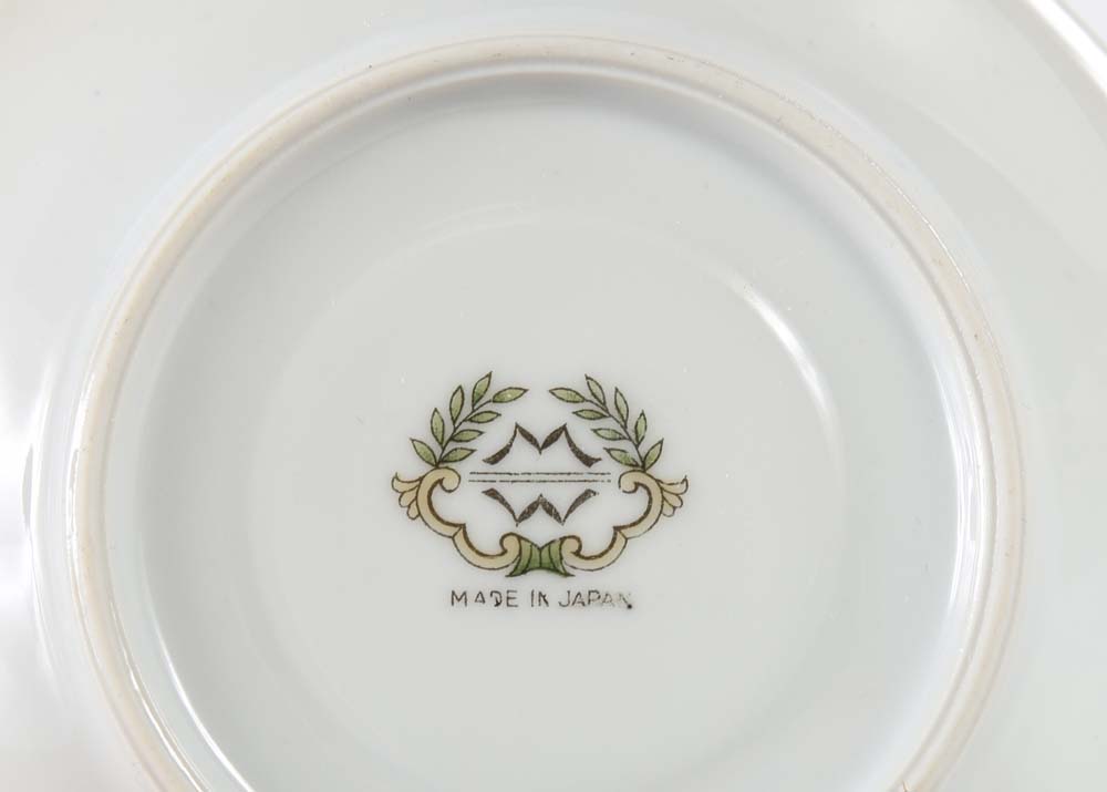 Assortment of Tea Cups, Saucers, and Spoon Rest