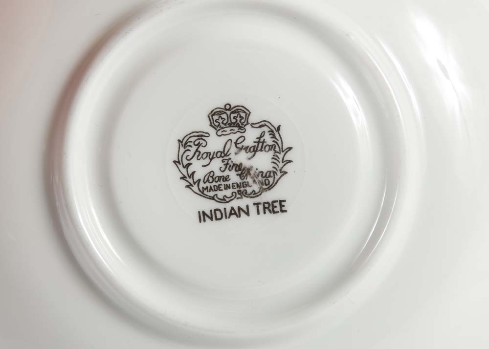 Assortment of Tea Cups, Saucers, and Spoon Rest