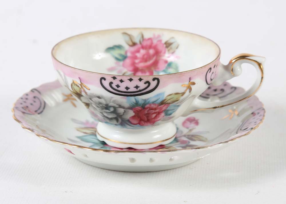 Assortment of Tea Cups, Saucers, and Spoon Rest