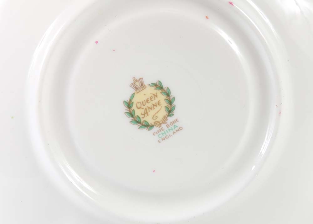 Assortment of Tea Cups, Saucers, and Spoon Rest