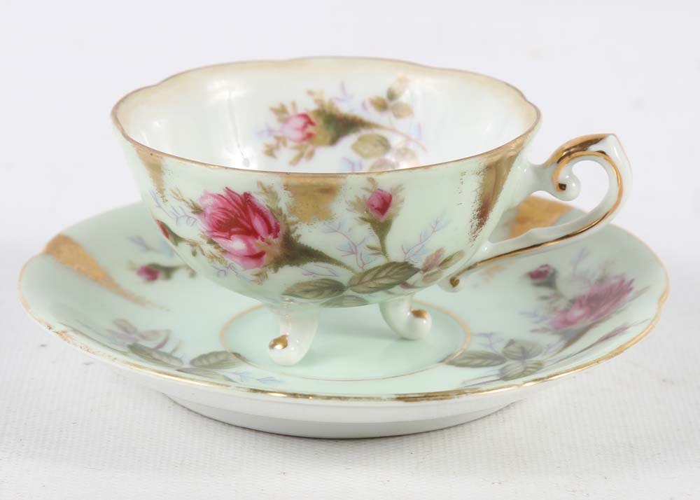 Assortment of Tea Cups, Saucers, and Spoon Rest