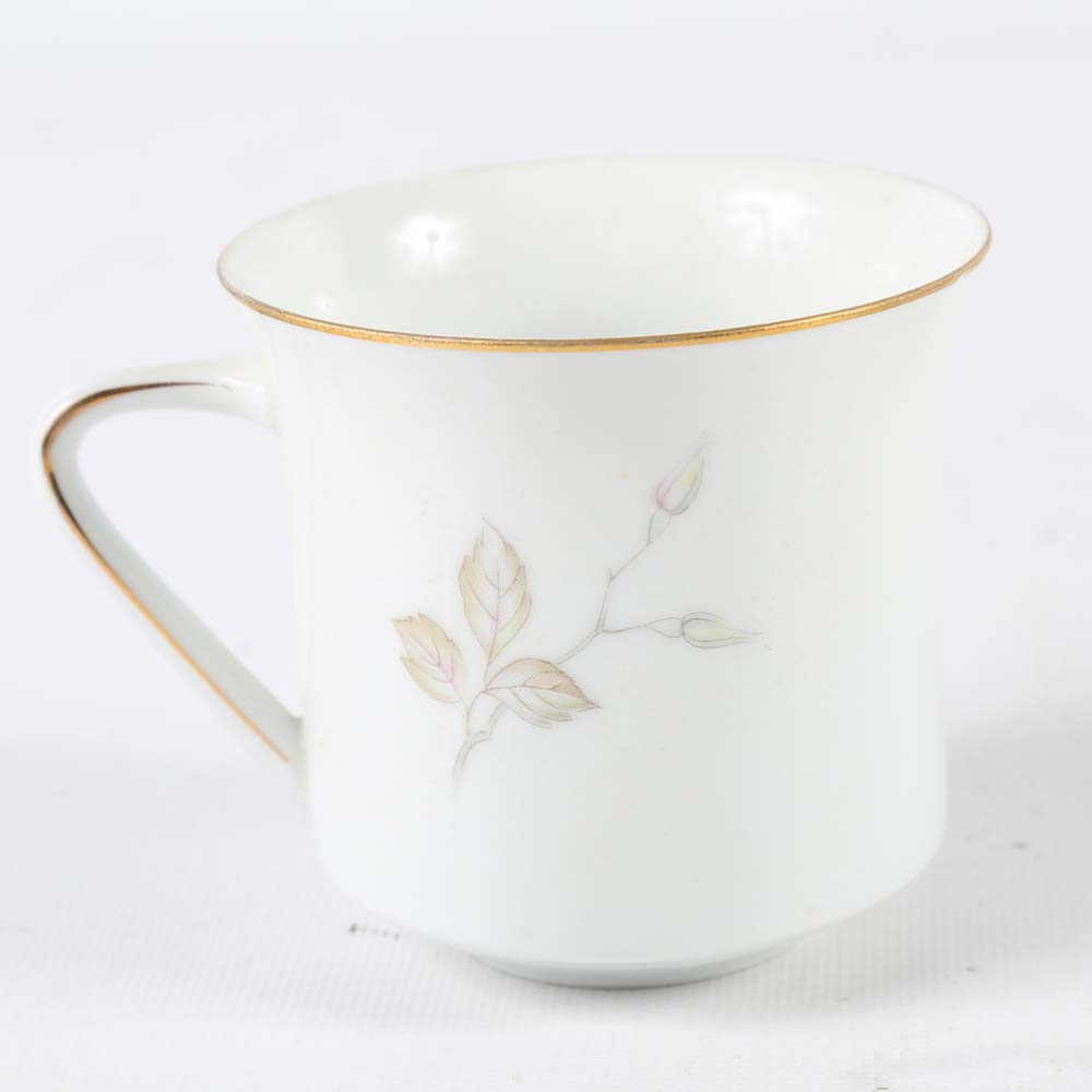 Assortment of Tea Cups, Saucers, and Spoon Rest