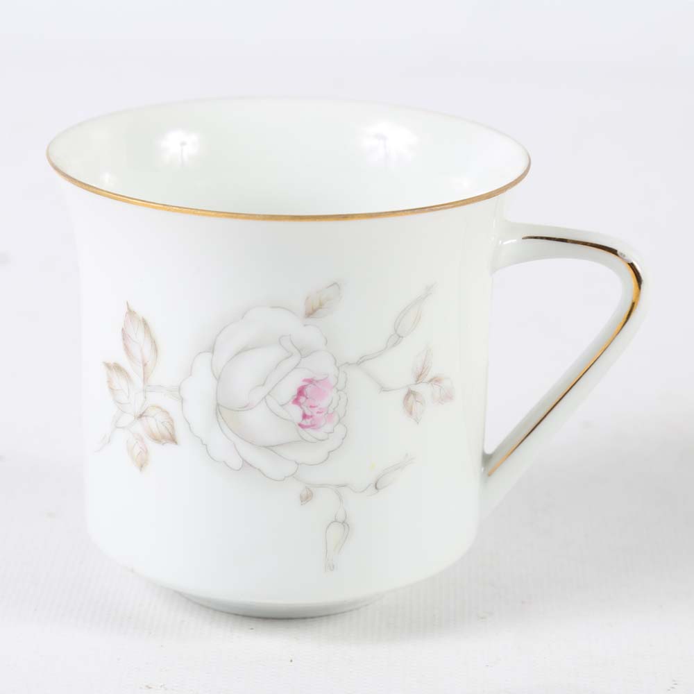 Assortment of Tea Cups, Saucers, and Spoon Rest