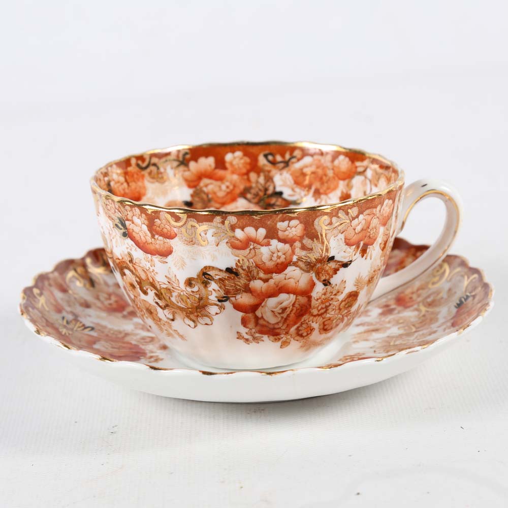 Assortment of Tea Cups, Saucers, and Spoon Rest