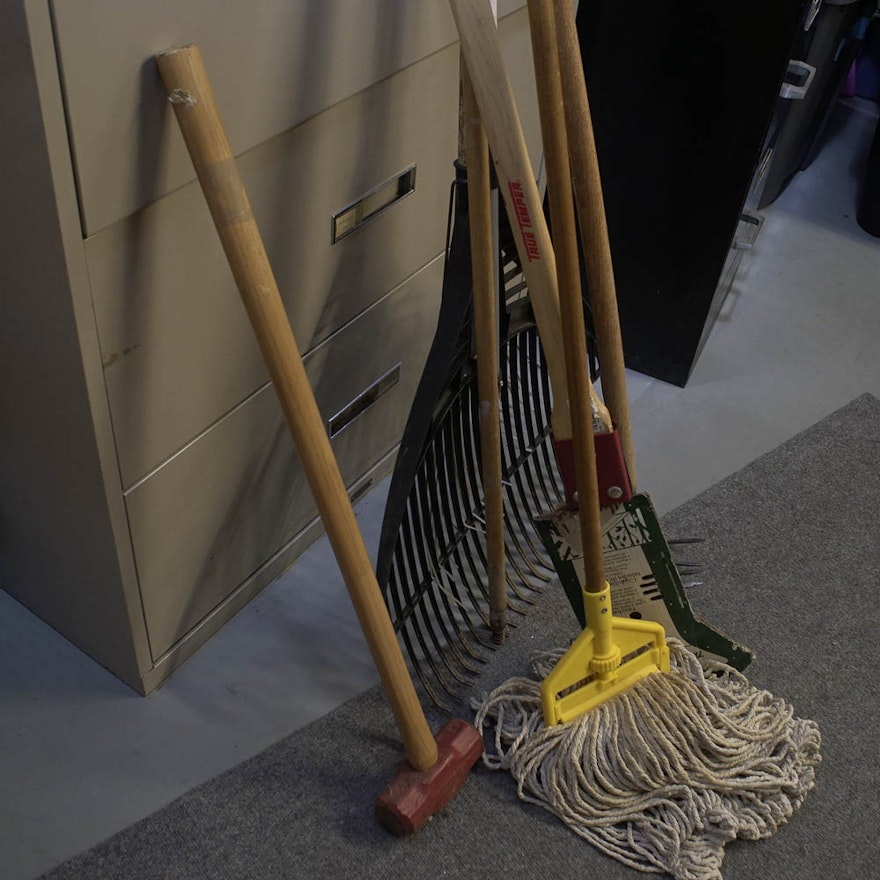Household Tools Including Sledge Hammer, Mop, Rake, and Cultivator