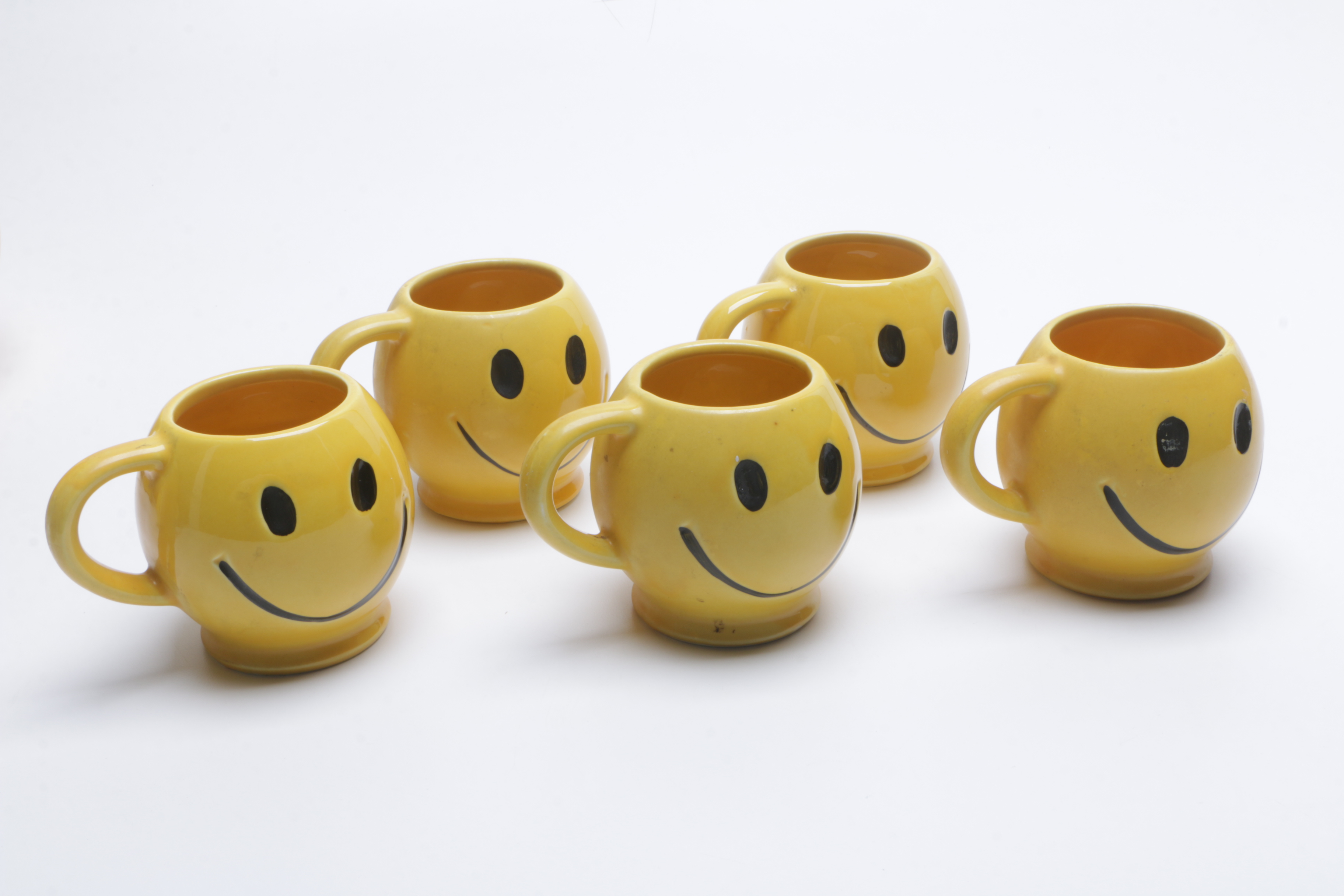1970s McCoy Pottery "Have a Happy Day" Smiley Face Mugs, Cookie Jar, and Bank
