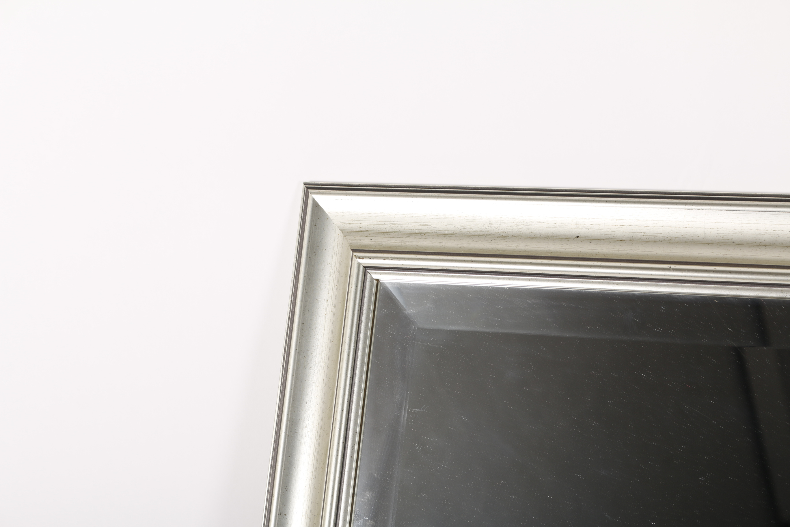 Molded Silver Tone Framed Beveled Wall Mirror