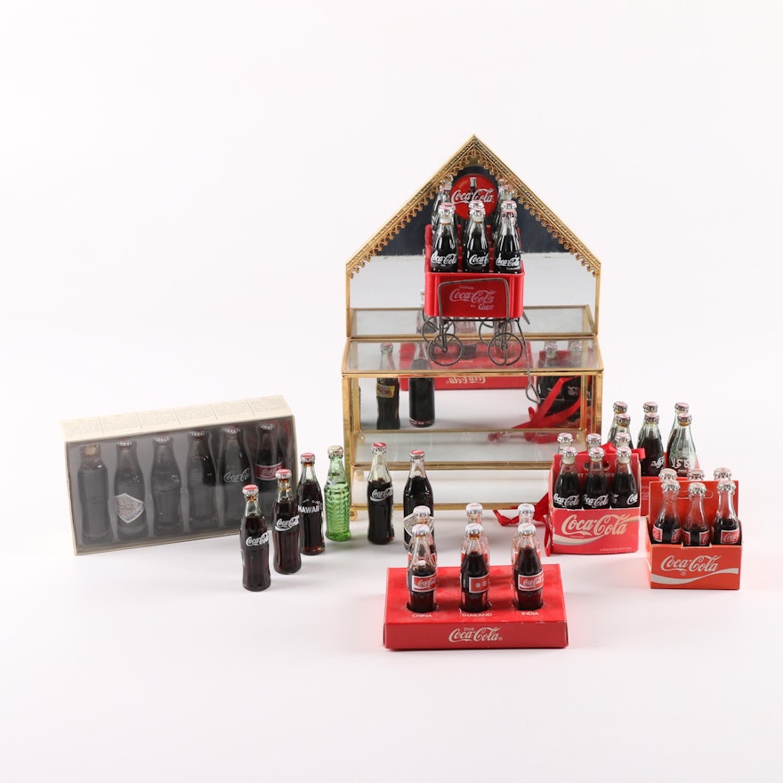 Collection of Miniature Coca-Cola Bottles with Display