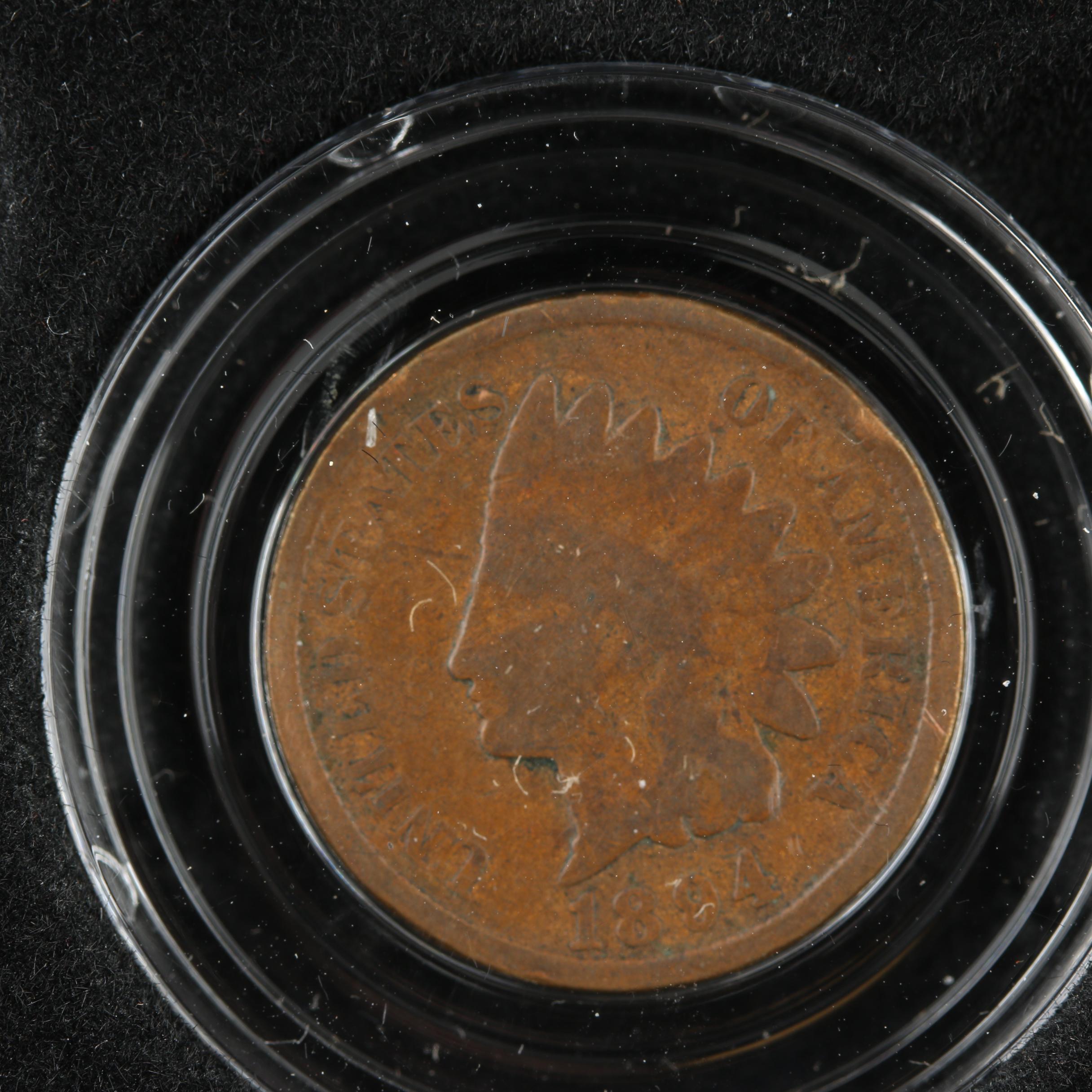 Display Case of Indian Head Cents and Native American Dollar Coins
