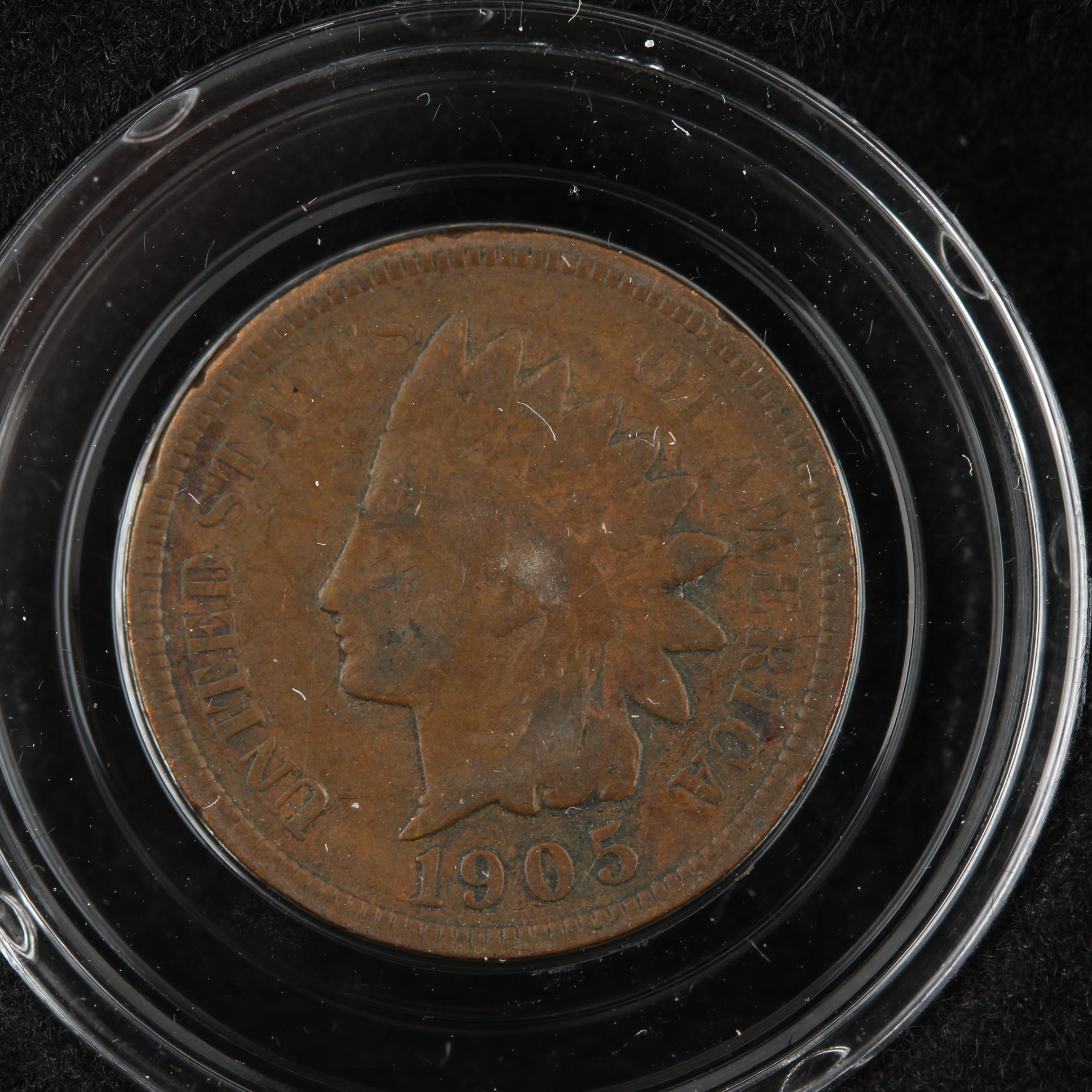 Display Case of Indian Head Cents and Native American Dollar Coins