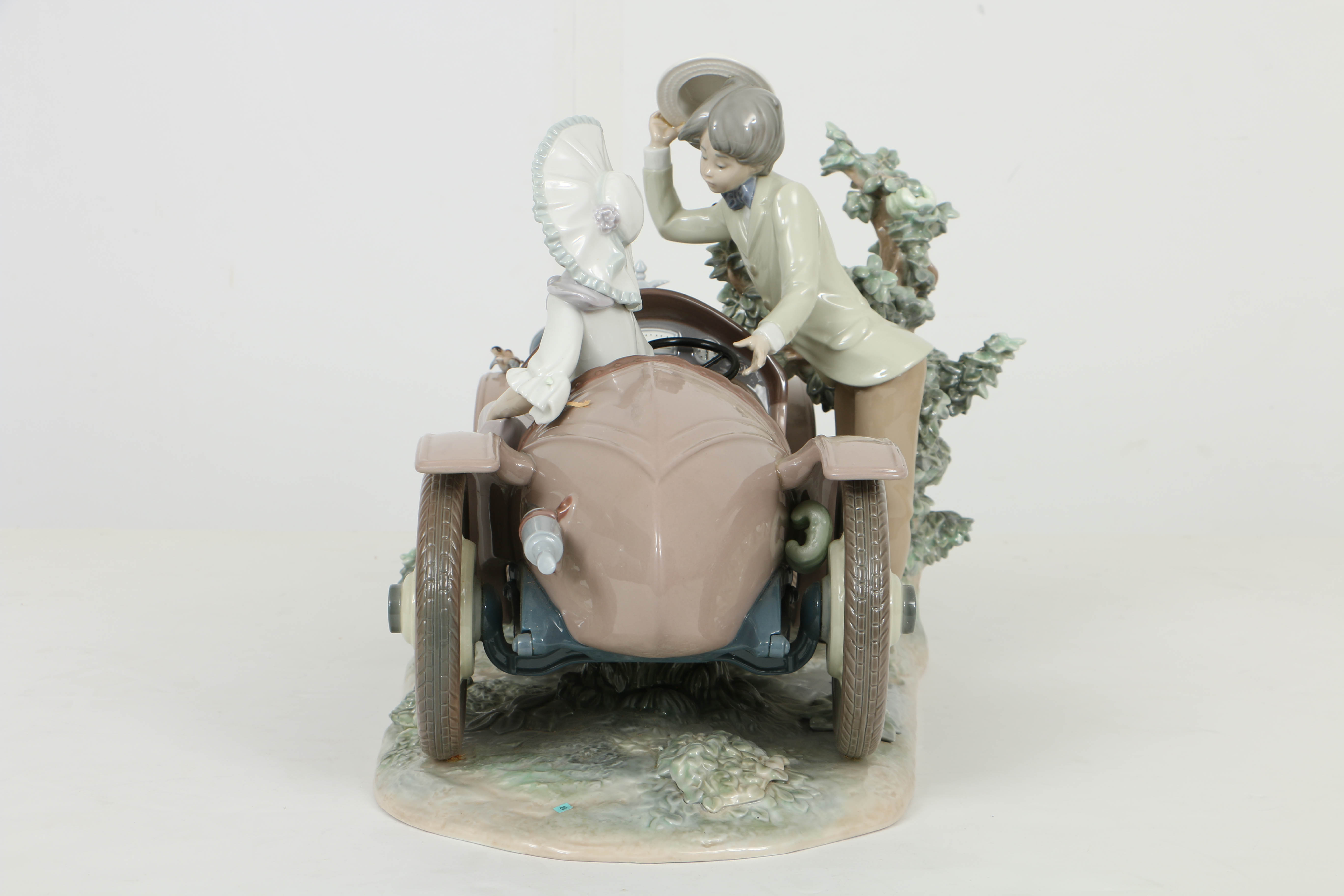 Limited Edition Lladro Figurine Of a "Young Couple with Car"