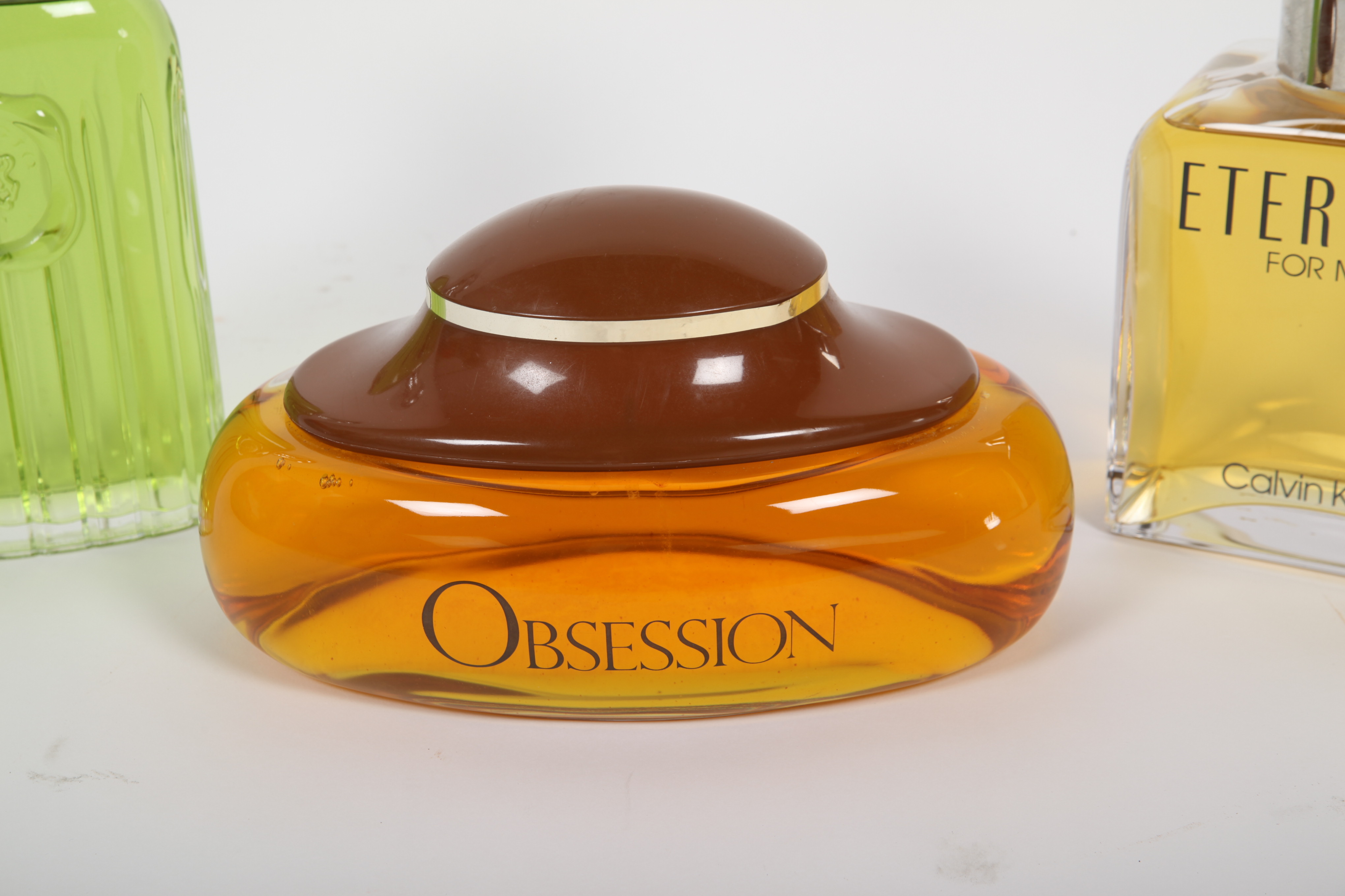 Large Men's Cologne Advertisement Bottles Featuring Calvin Klein