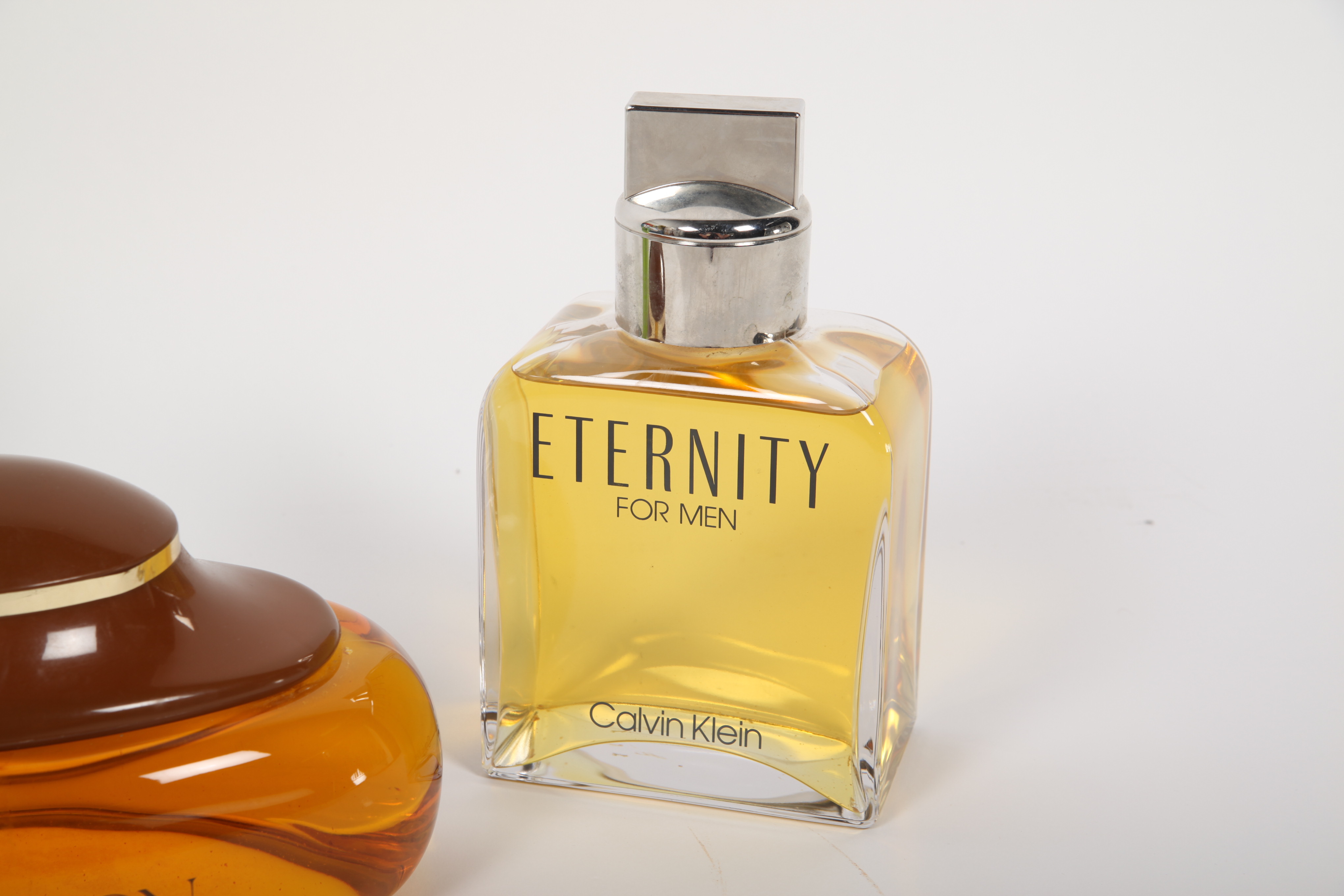 Large Men's Cologne Advertisement Bottles Featuring Calvin Klein