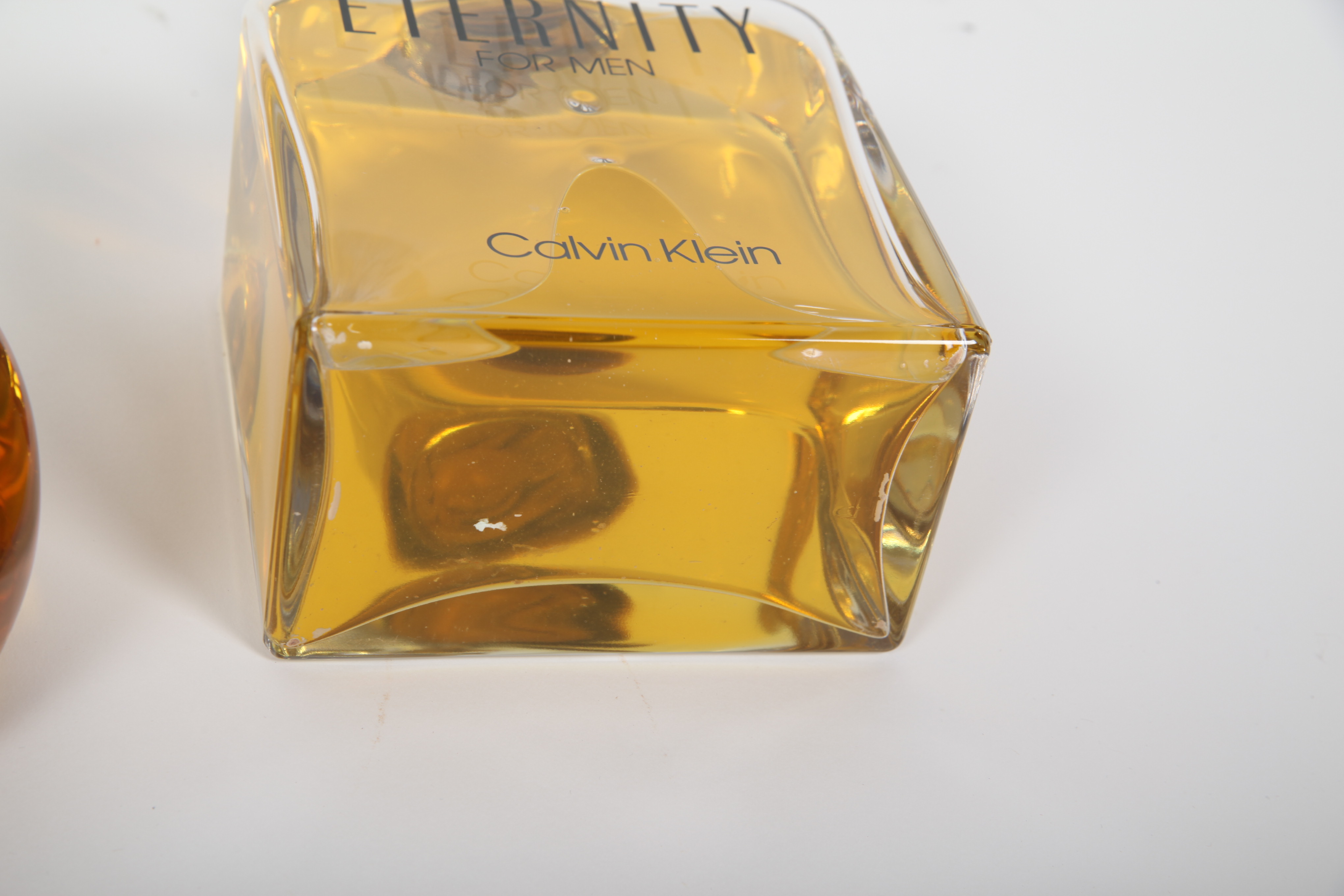 Large Men's Cologne Advertisement Bottles Featuring Calvin Klein