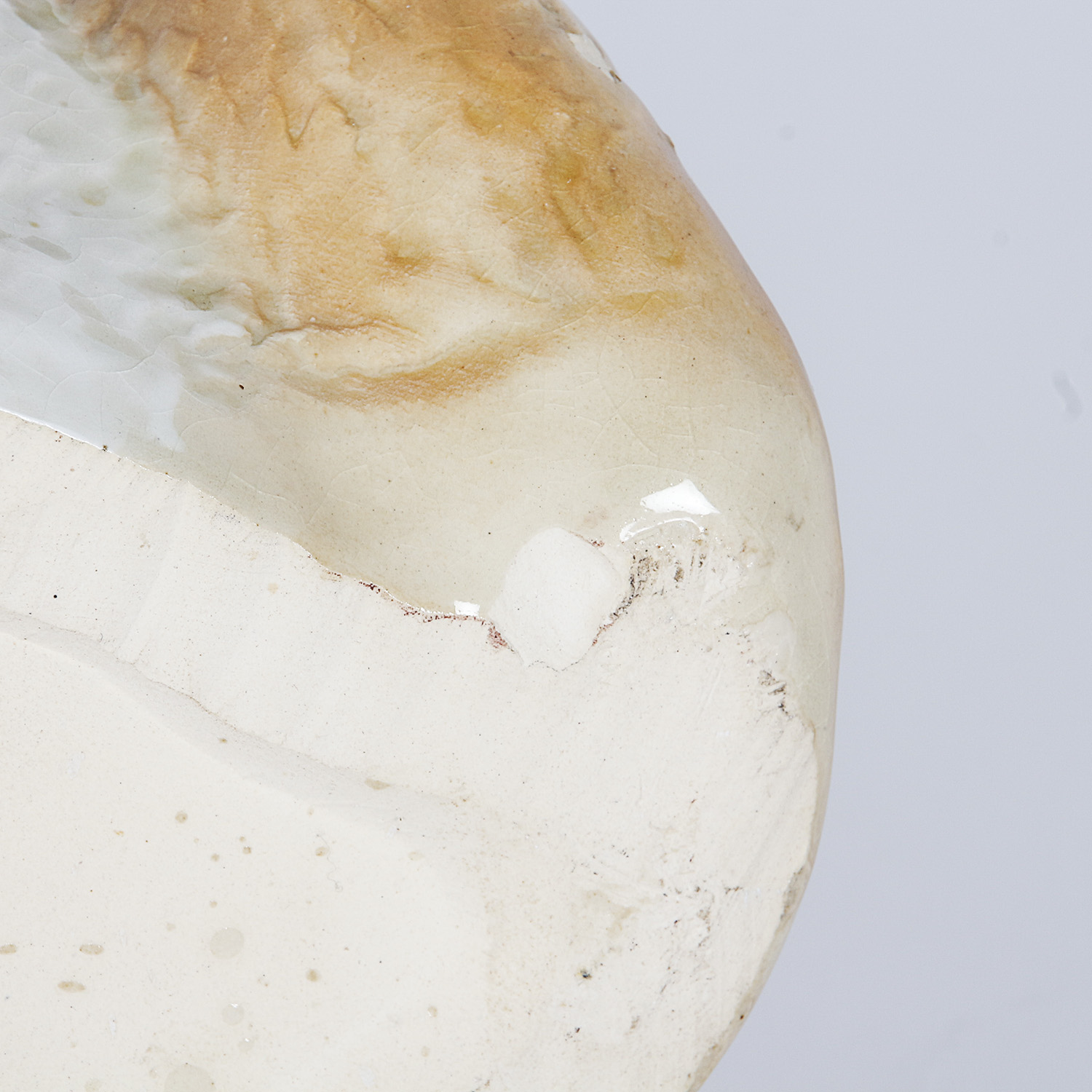 Brown and White Ceramic Dog Figurine