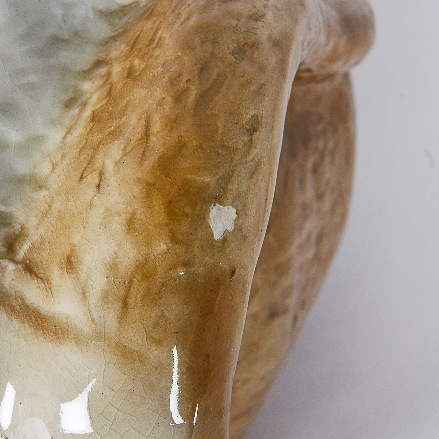 Brown and White Ceramic Dog Figurine