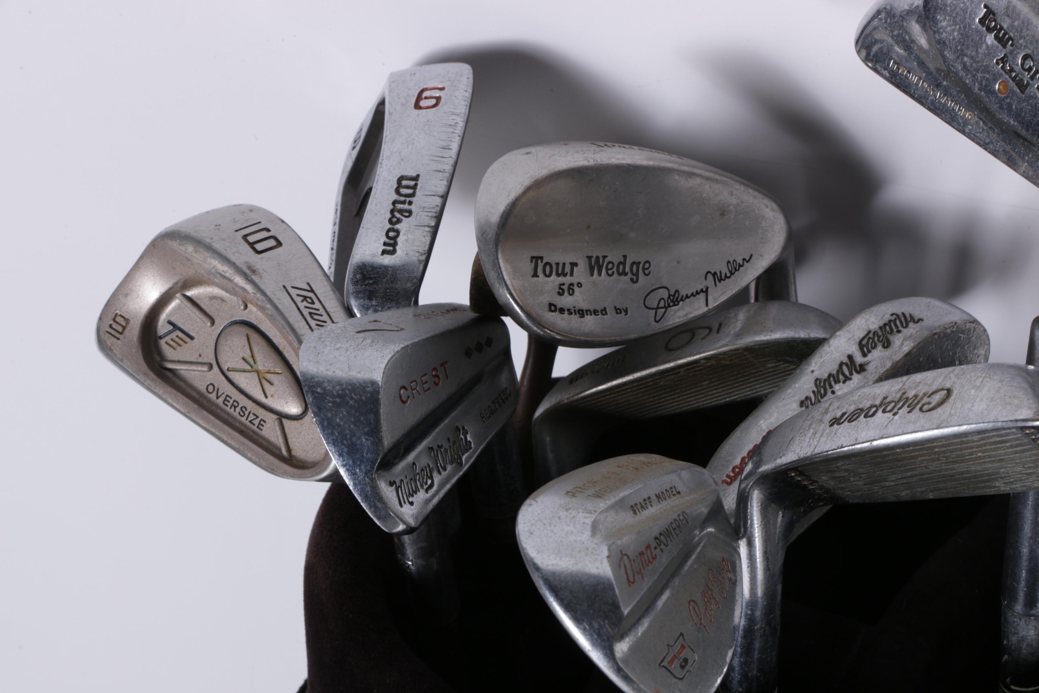 Various Golf Clubs with a Pair of Cases