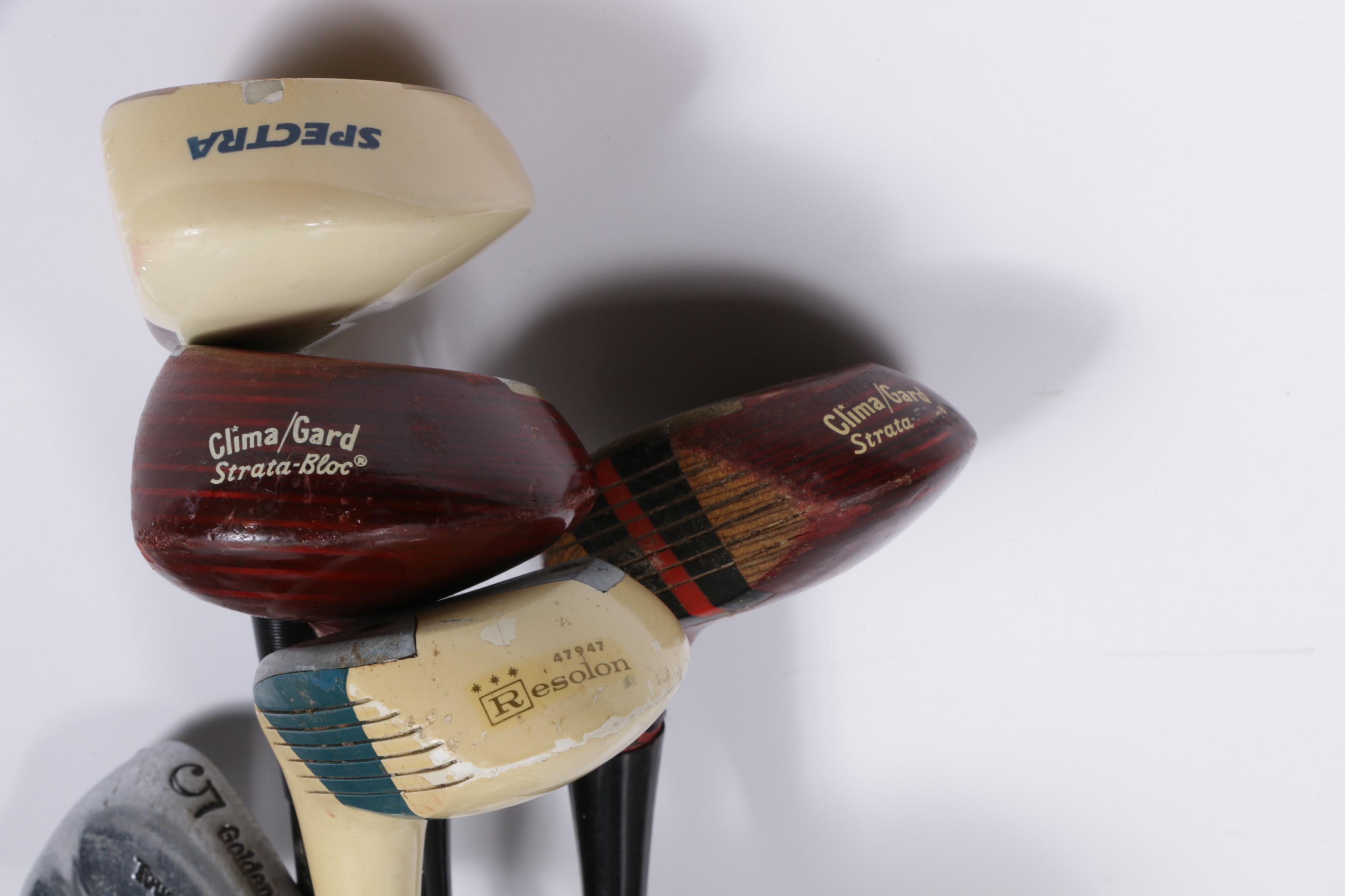 Various Golf Clubs with a Pair of Cases