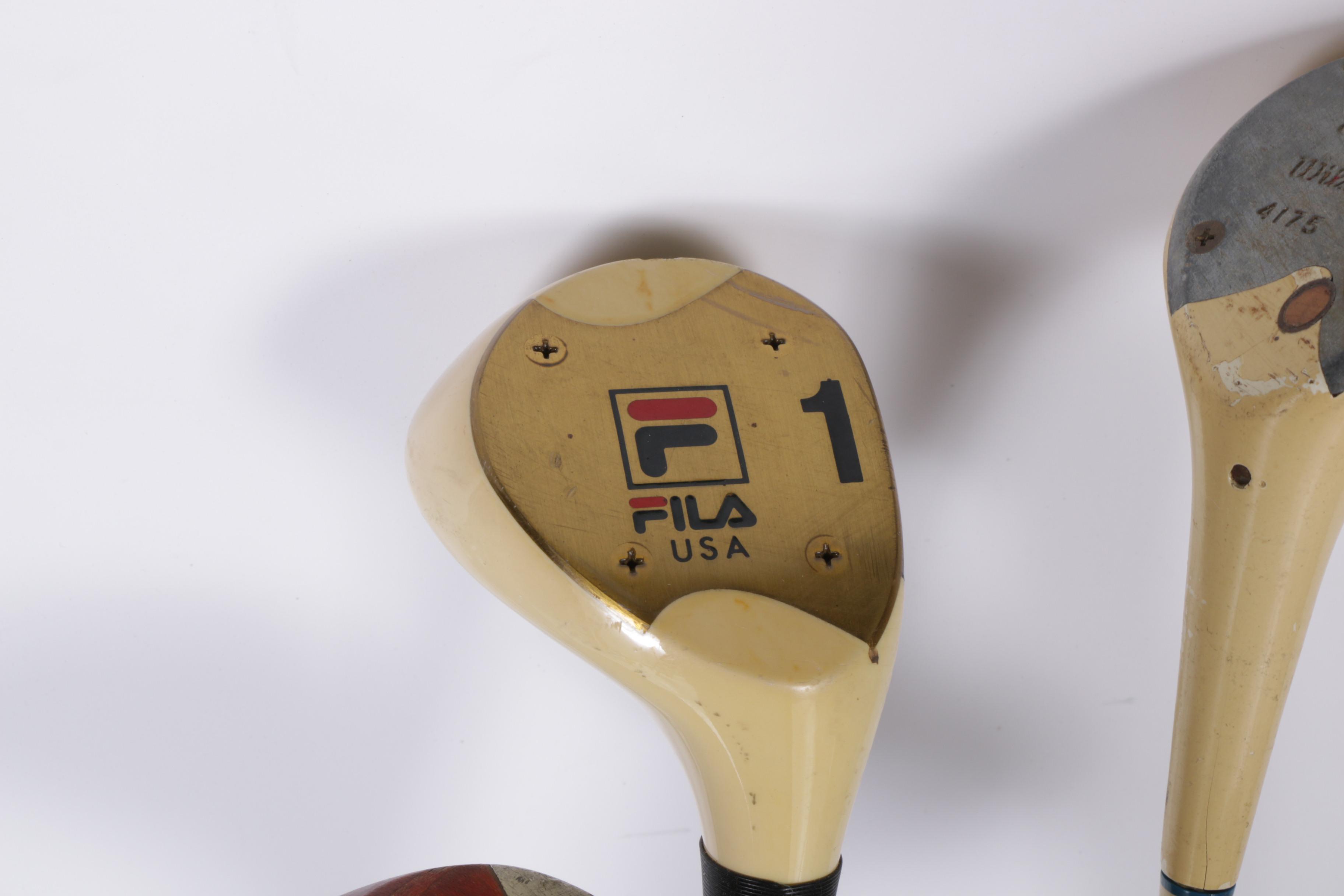 Various Golf Clubs with a Pair of Cases