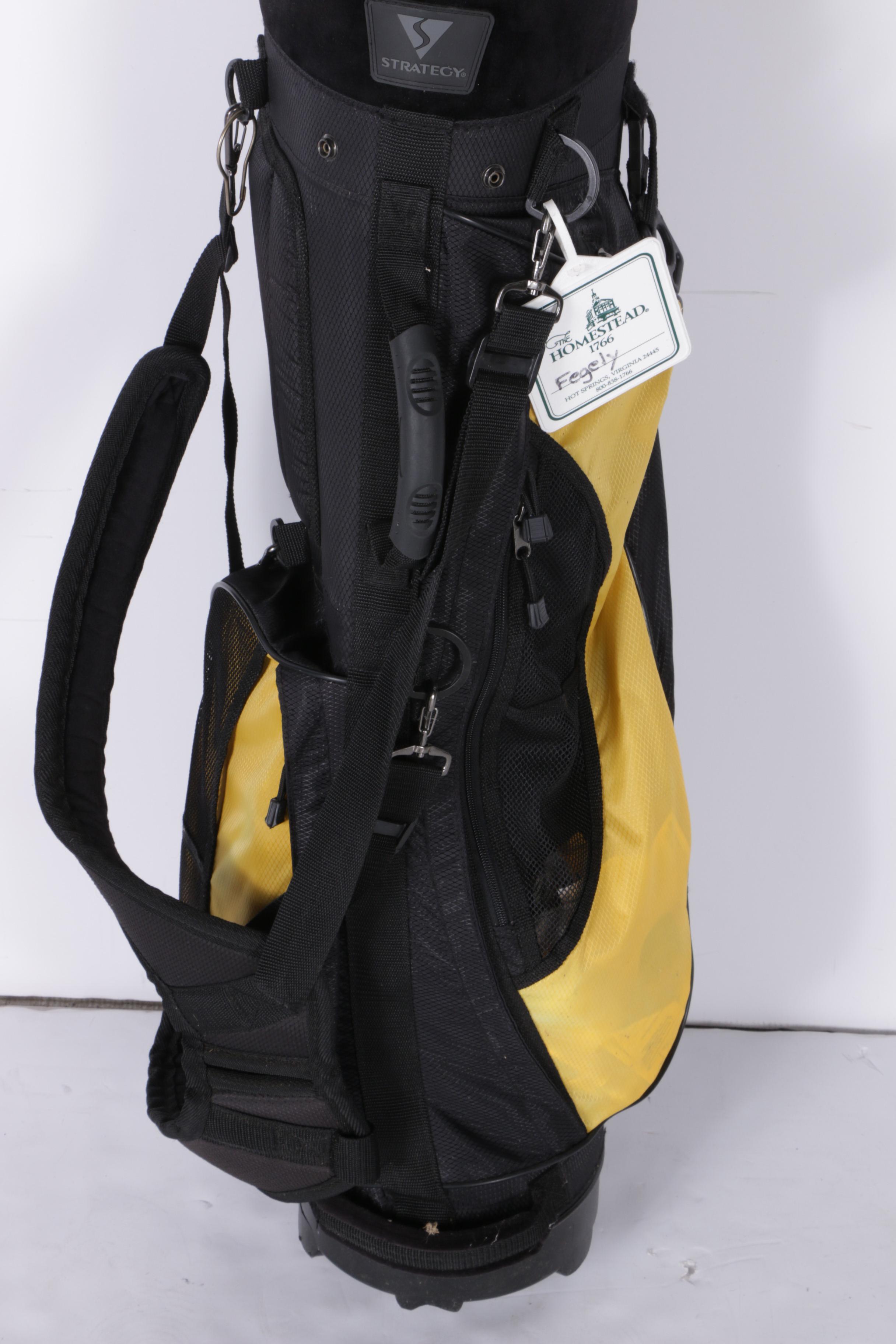 Various Golf Clubs with a Pair of Cases