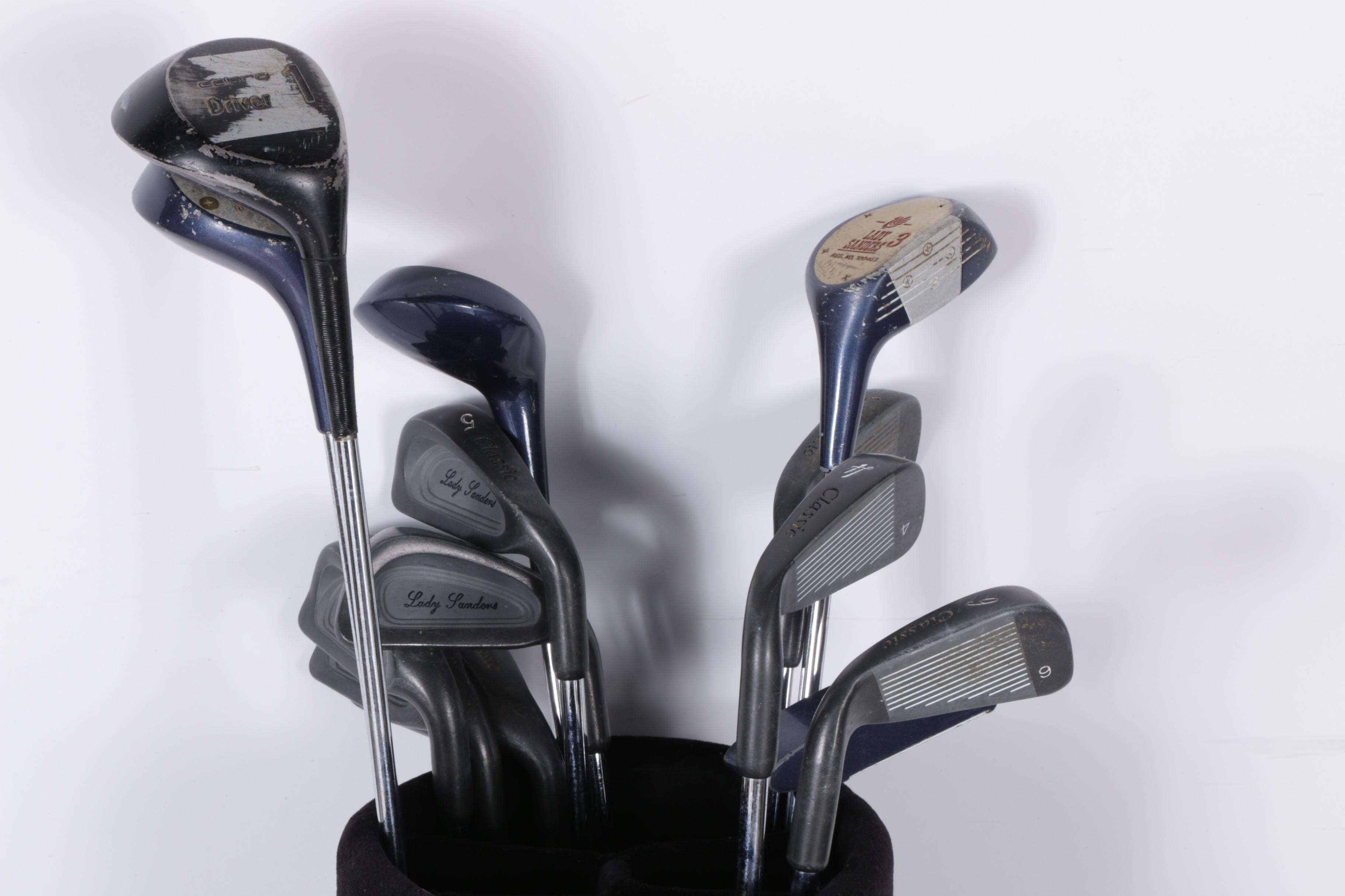 Various Golf Clubs with a Pair of Cases