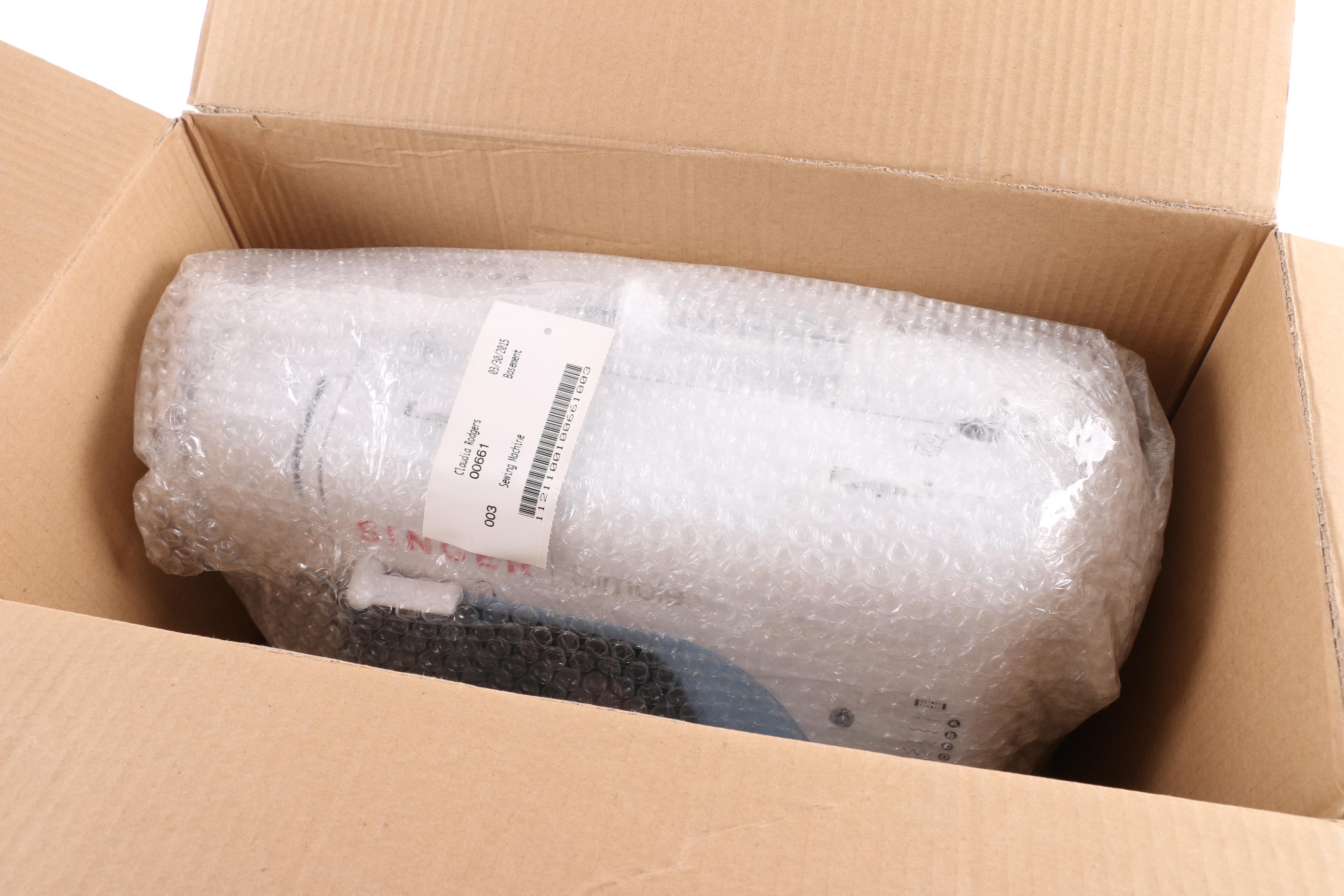 Singer "Simple" Sewing Machine with Books