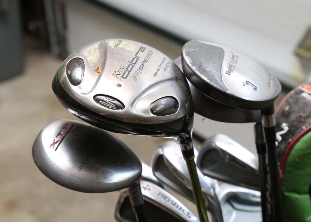 A Set of Various Golf Clubs With Callaway Bag