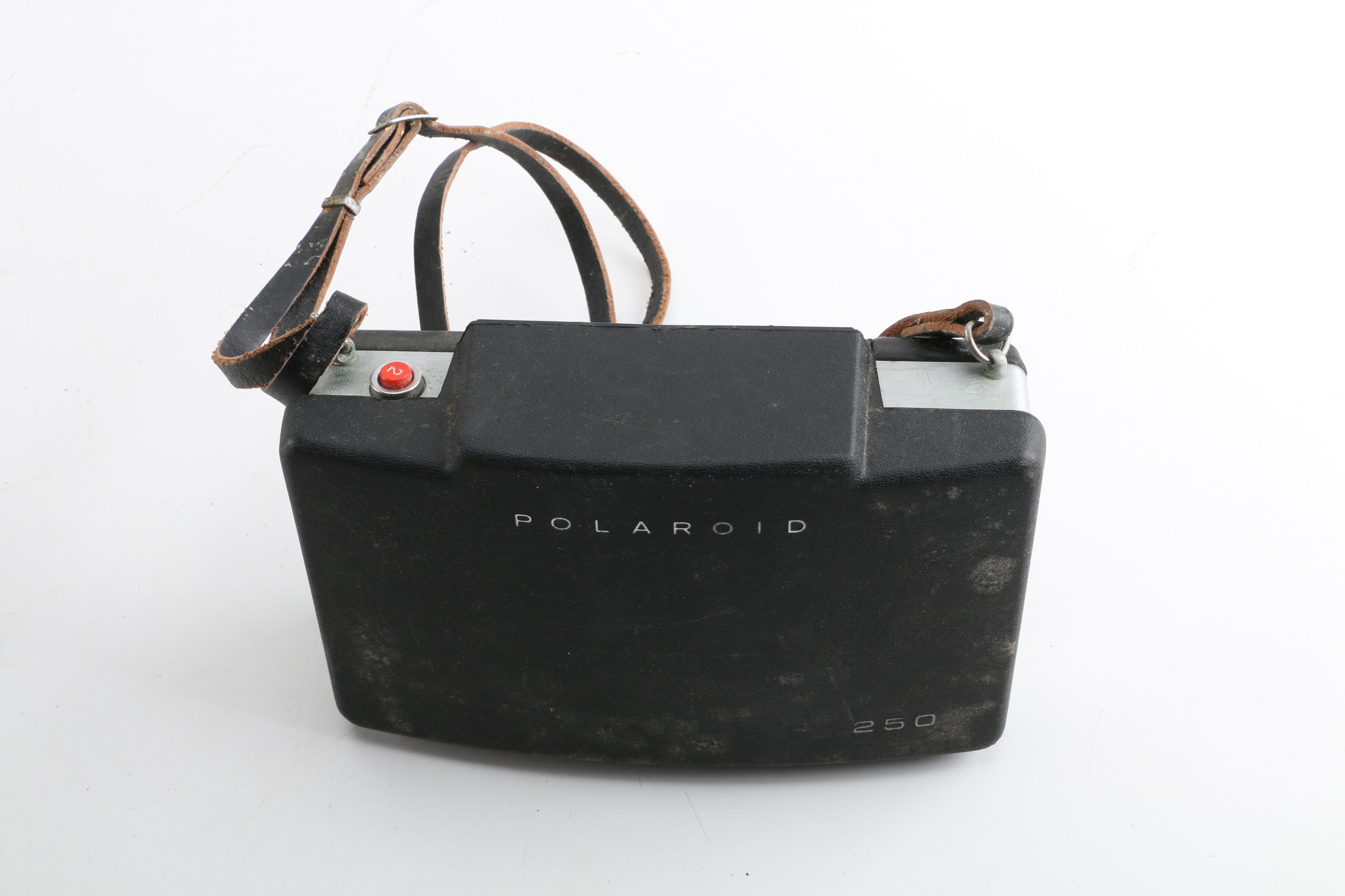 Polaroid 250 and Bell and Howell Hand-Held Video Camera