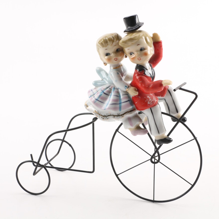 Boy and Girl Ceramic Figurines on Metal Bike